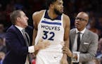Timberwolves center Karl-Anthony Towns was led away after an altercation with 76ers center Joel Embiid during the second half Wednesday. Both players 