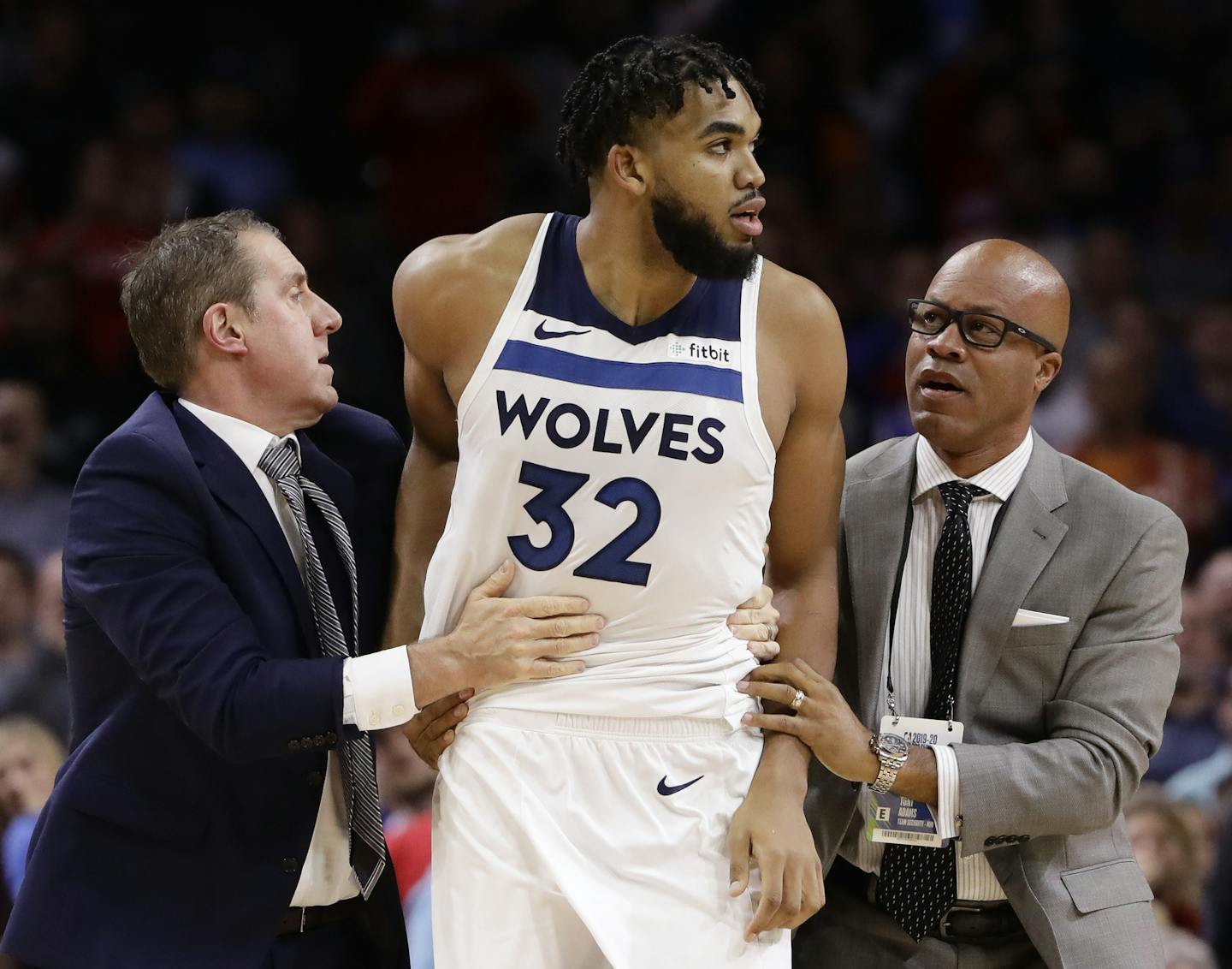 Timberwolves center Karl-Anthony Towns was led away after an altercation with 76ers center Joel Embiid during the second half Wednesday. Both players were ejected and eventually given two-game suspensions.