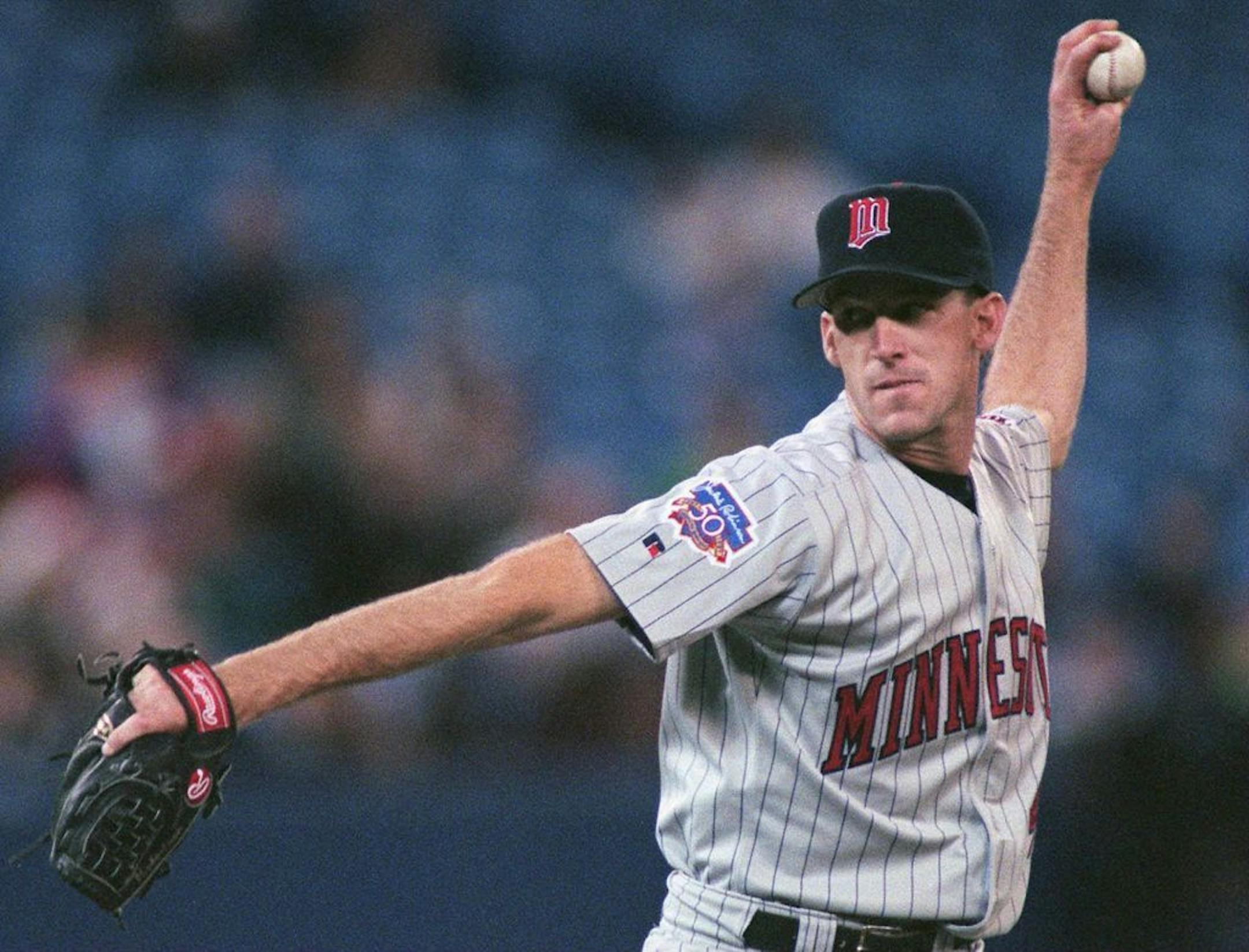 Minnesota Twins starting pitcher Rich Robertson winds up as he pitches during against the Toronto Blue Jays Saturday, May 3, 1997 in Toronto.