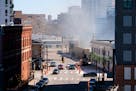 Smoke from the building fire on East Hennepin Ave. emerges on Sunday, April 14, 2024 in Minneapolis, Minn.