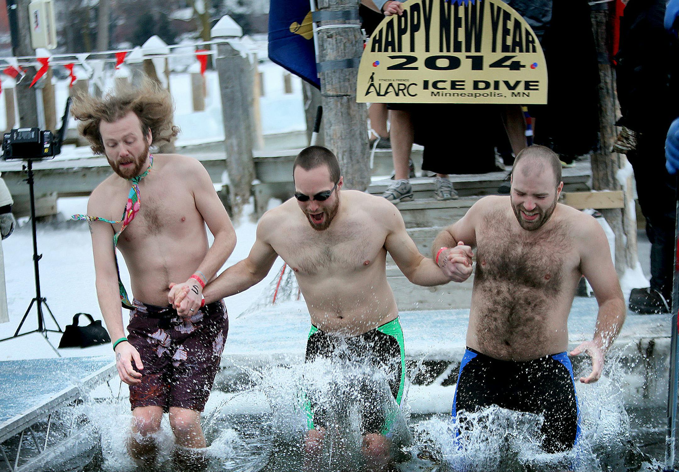 More than 700 people jumped into 31 degree water in Lake Minnetonka to celebrate New Year's Day ALARC Ice Dive, Wednesday, January 1, 2014 in Excelsior, MN. The annual tradition raised money for Ride 2 Recovery. The R2R organization is produced by the Fitness Challenge, a (501C3) in partnership with the Military and VA Volunteer Service Office to benefit mental and physical rehabilitation programs for wounded veterans and healing heroes that features cycling as the core activity. (ELIZABETH FLOR