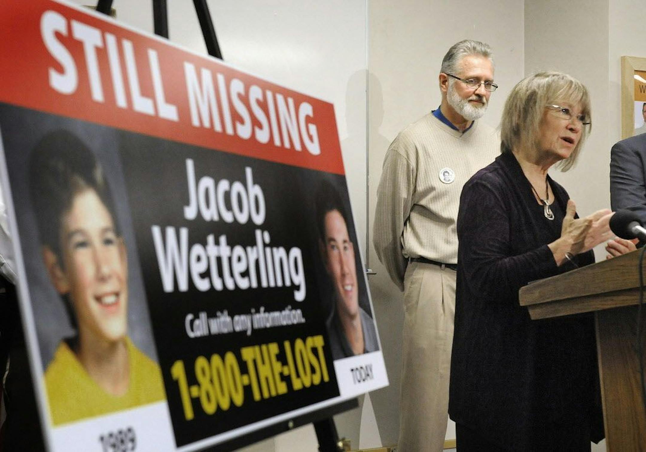 ADVANCE FOR DEC. 25 AND THEREAFTER - FILE - In this Oct. 14, 2014 file photo, Patty, right, and Jerry Wetterling take part in a news conference at the Stearns County Law Enforcement Center in St. Cloud, Minn., to announce the installation of six new billboards that will be placed near where their son Jacob was abducted in 1989. Federal charges stemming from a long-term child exploitation investigation were announced Thursday, Oct. 29, 2015 against Daniel Heinrich. The FBI says Heinrich is a pers
