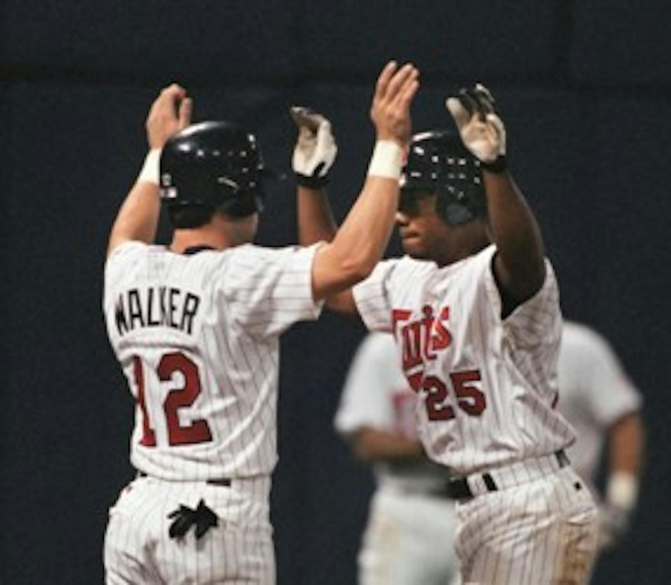 Todd Walker and Alex Ochoa, showing off their synchronized home plate routine