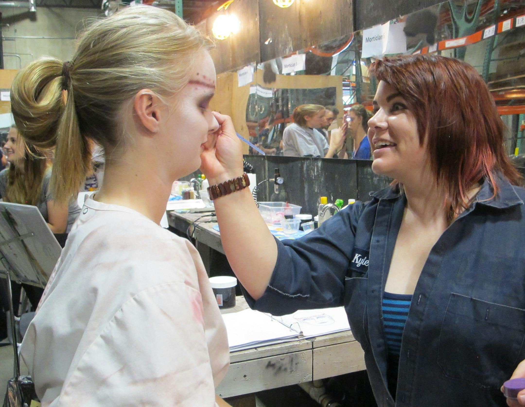 Dylan Belden * dylan.belden@startribune.com Makeup artist Karla Schmitt got Trianna Nuetzman ready during training for the Halloween Haunt at Valleyfair in Shakopee last week. The Halloween event started on Saturday and runs most weekend days through Oct. 26.