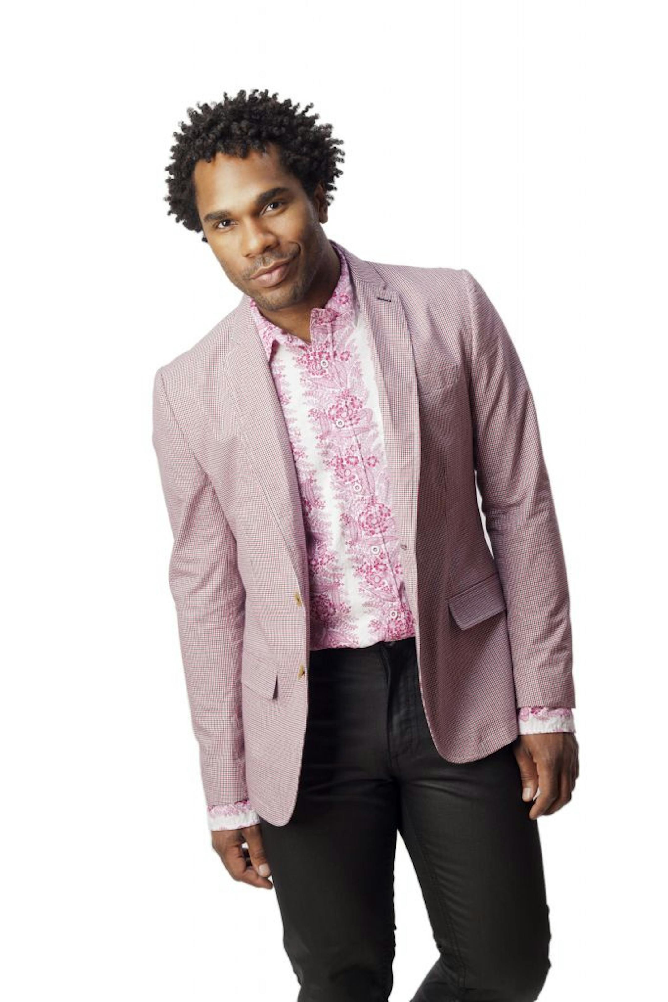 Photos courtesy of edbockeditions.com Sons of Intrigue blazer ($99), Vintage Red shirt ($59) and Request coated jeans ($69) from Macy's. Edgy color: "When I saw the shirt and jacket together, I thought it would really pop with the dark coated jeans," said McPherson. Model turned musician Herschel McPherson of Minneapolis flaunts his personal style.