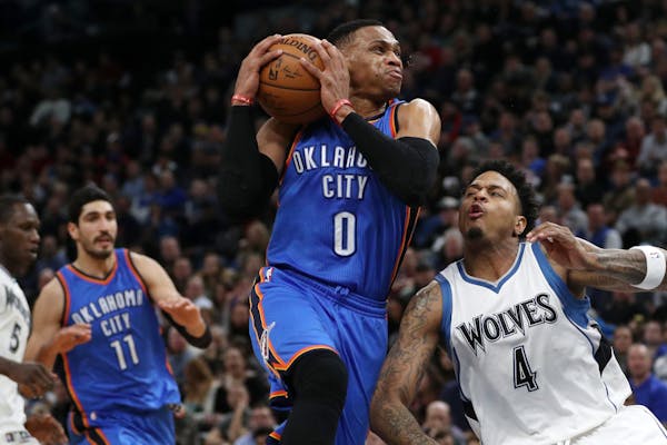 The Oklahoma City Thunder's Russell Westbrook (0) drives to the basket against the Minnesota Timberwolves' Brandon Rush (4)