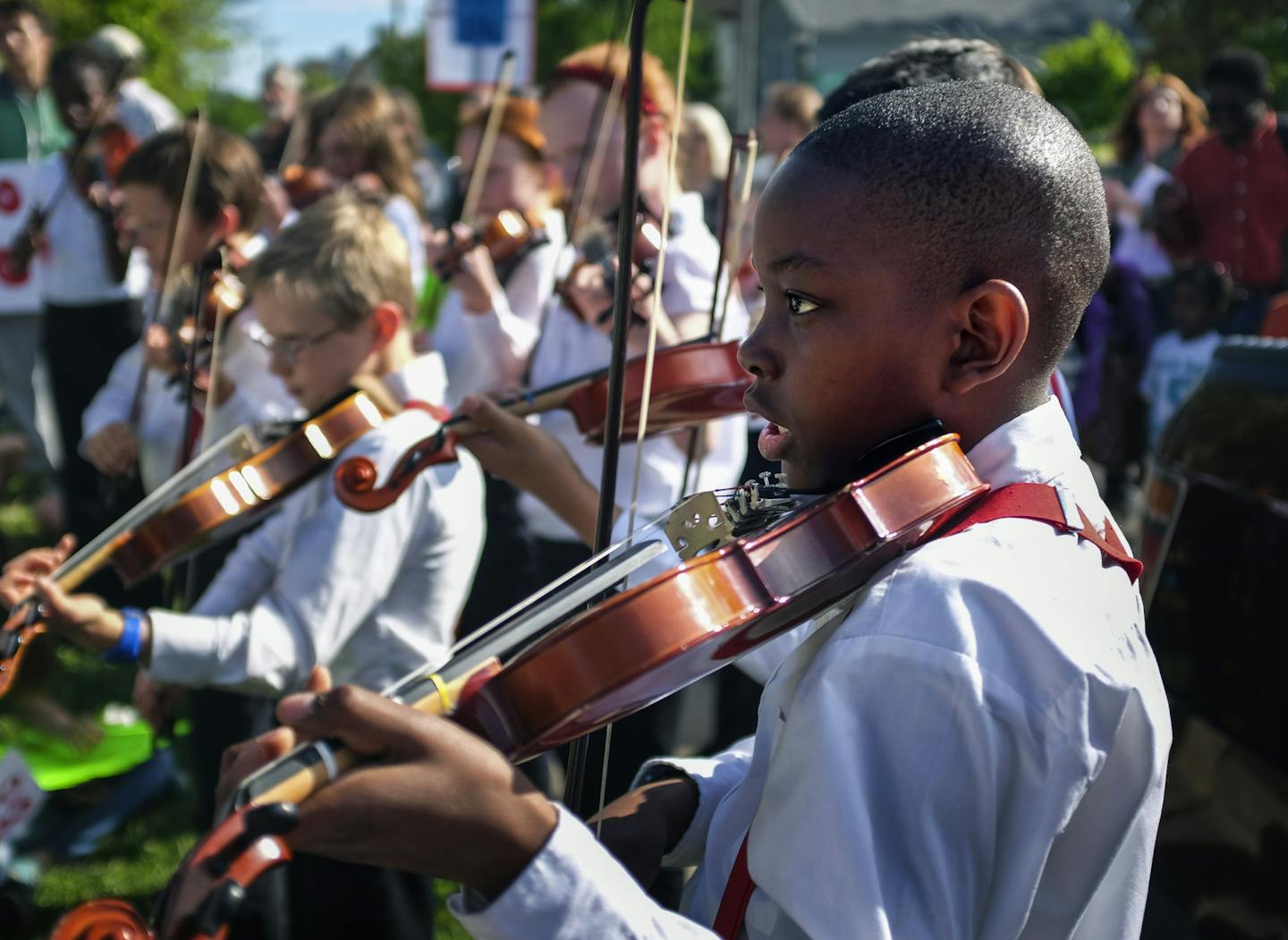 Violinist Far Halle of the LNFI ( L'Etoile du Nord French Immersion School) Fabulous Fiddlers music group, joined the protest with a few songs outside the St. Paul School District Offices Tuesday afternoon. ] Parents and advocates staged a rally Tuesday to protest cuts to music, art and other programs in the St. Paul school district. The school board must resolve a $15.1 million budget shortfall for 2016-17 and are exploring a cost-saving maneuver that would limit electives in the elementary and