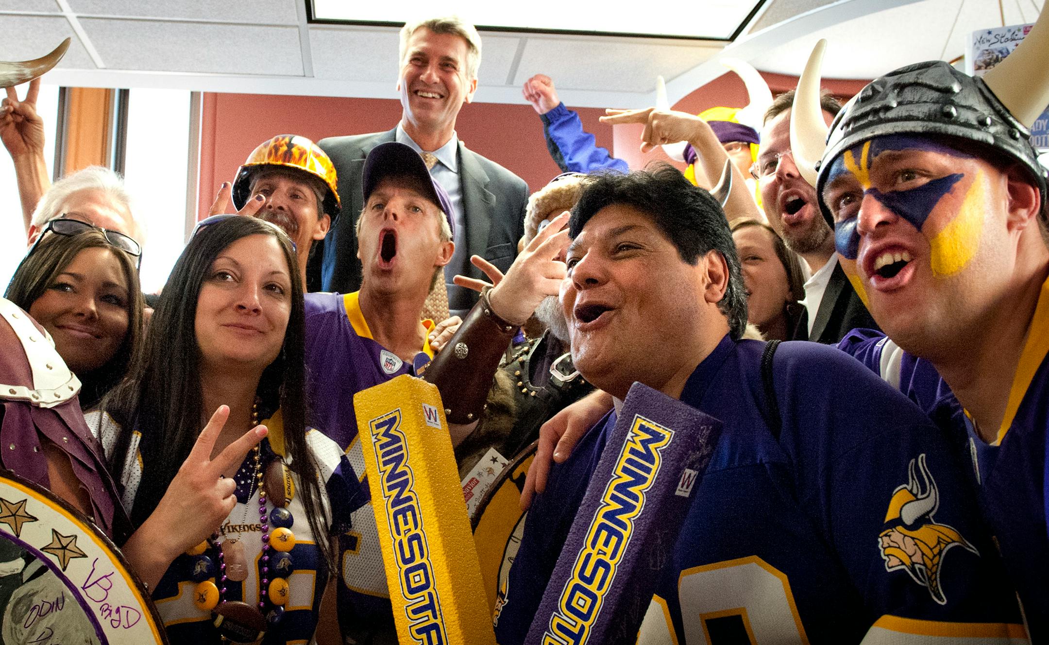 Vikings fans celebrated in the Mayor's office after the Minneapolis City Council voted to build a Vikings Stadium.