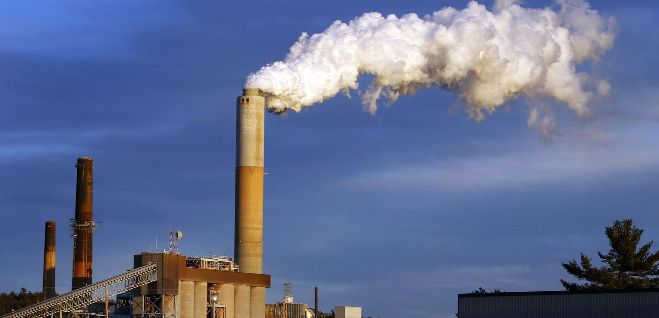FILE - In this Jan. 20, 2015 file photo, a plume of steam billows from the coal-fired Merrimack Station in Bow, N.H. President Barack Obama on Monday, Aug. 3, 2015, will unveil the final version of his unprecedented regulations clamping down on carbon dioxide emissions from existing U.S. power plants. The Obama administration first proposed the rule last year. Opponents plan to sue immediately to stop the rule's implementation. (AP Photo/Jim Cole, File) ORG XMIT: MIN2015080312481417