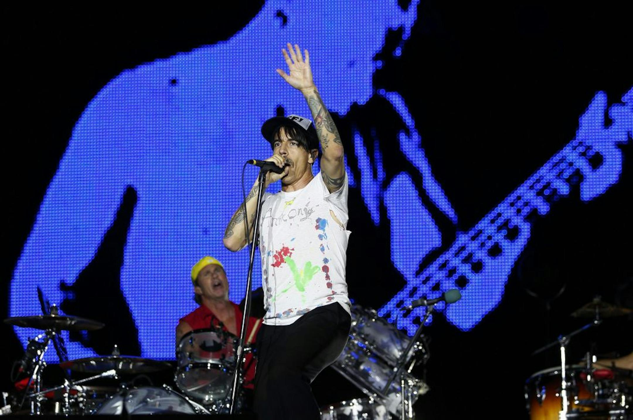 FILE - In this July 8, 2012 file photo, Red Hot Chili Peppers' Anthony Kiedis performs with drummer Chad Smith during the Rock in Rio music festival in Arganda del Rey, on the outskirts of Madrid, Spain. At the Austin City Limits Music Festival, about a third of the nearly 130 bands on a lineup that includes the Red Hot Chili Peppers, the Black Keys and Jack White will have their sets broadcast on YouTube. That's a record for the three-day festival that starts Friday, Oct. 12, 2012.