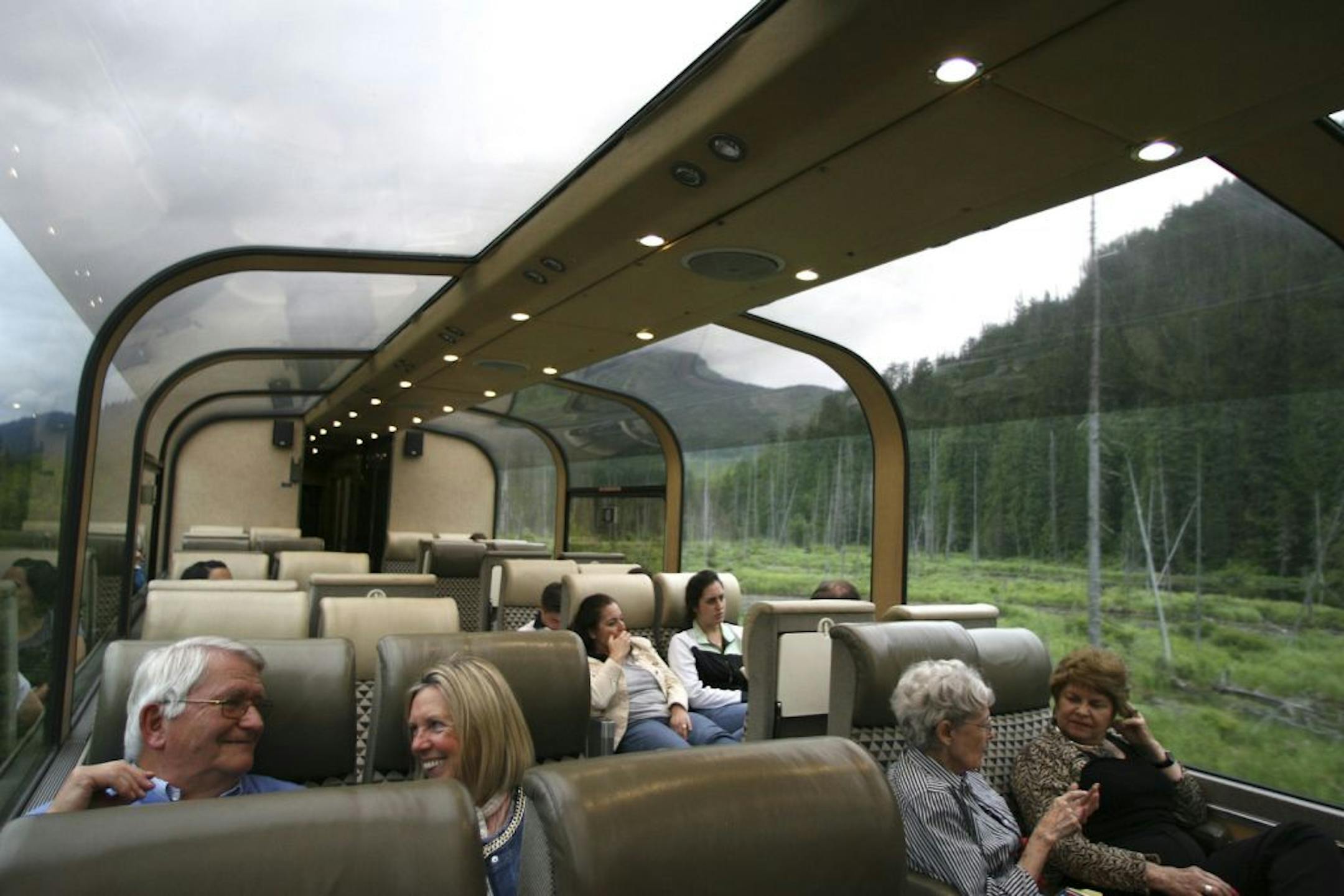 Passengers aboard the Canadian train get a view of the forest in the Canadian Rockies from the glass domed coach car, which was added to the west bound train in Edmonton.