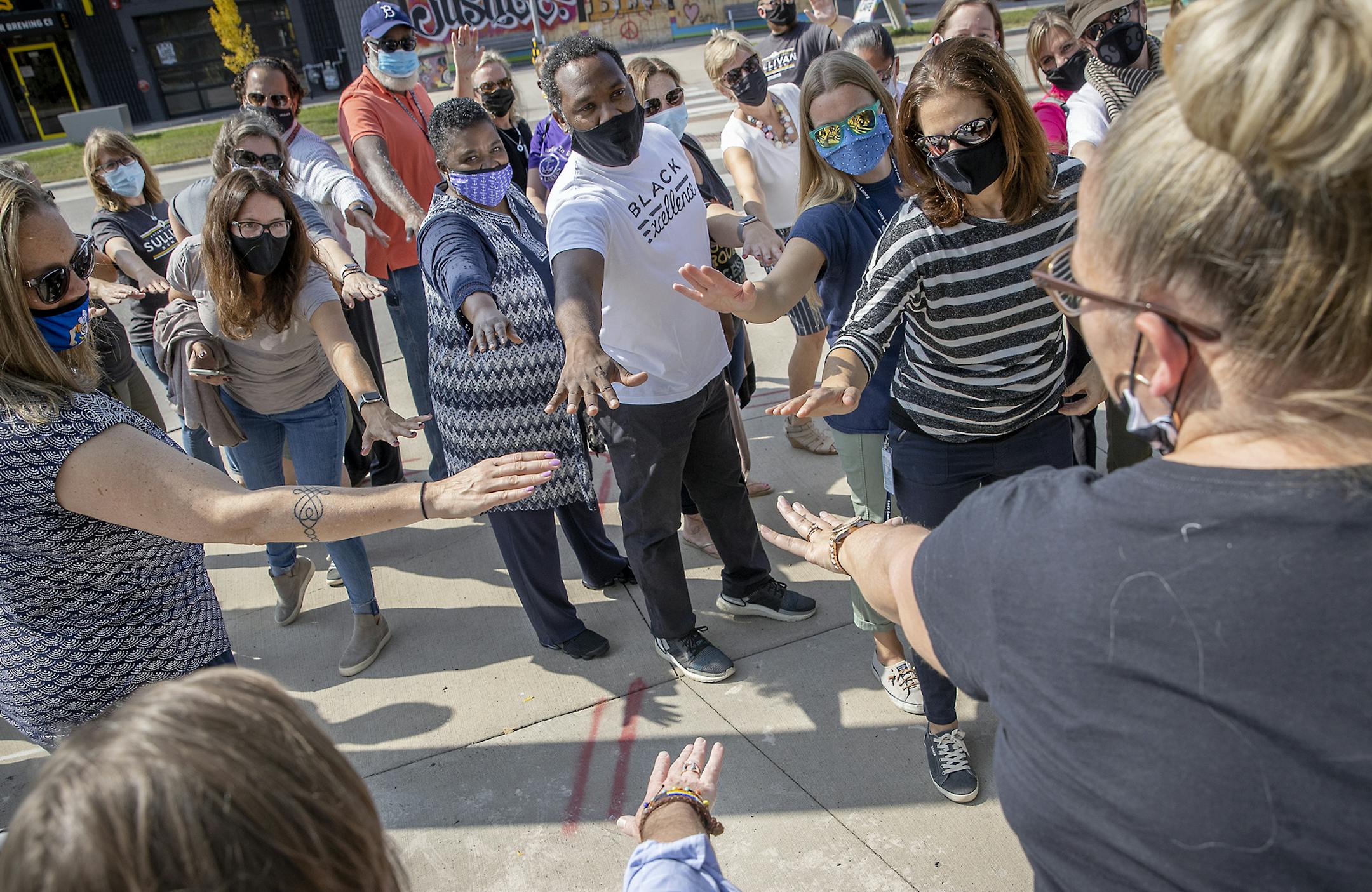 North High School Principal Mauri Friestleben, at far right, and more than 40 Minneapolis and metro-area school principals gathered last week for a "Good Trouble" coalition meeting at the site of the Third Police Precinct in Minneapolis. The group consists of school leaders working to combat racism and inequities in education.