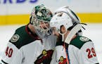 Wild goalie Devan Dubnyk celebrates with teammate Greg Pateryn after their victory over the St. Louis Blues