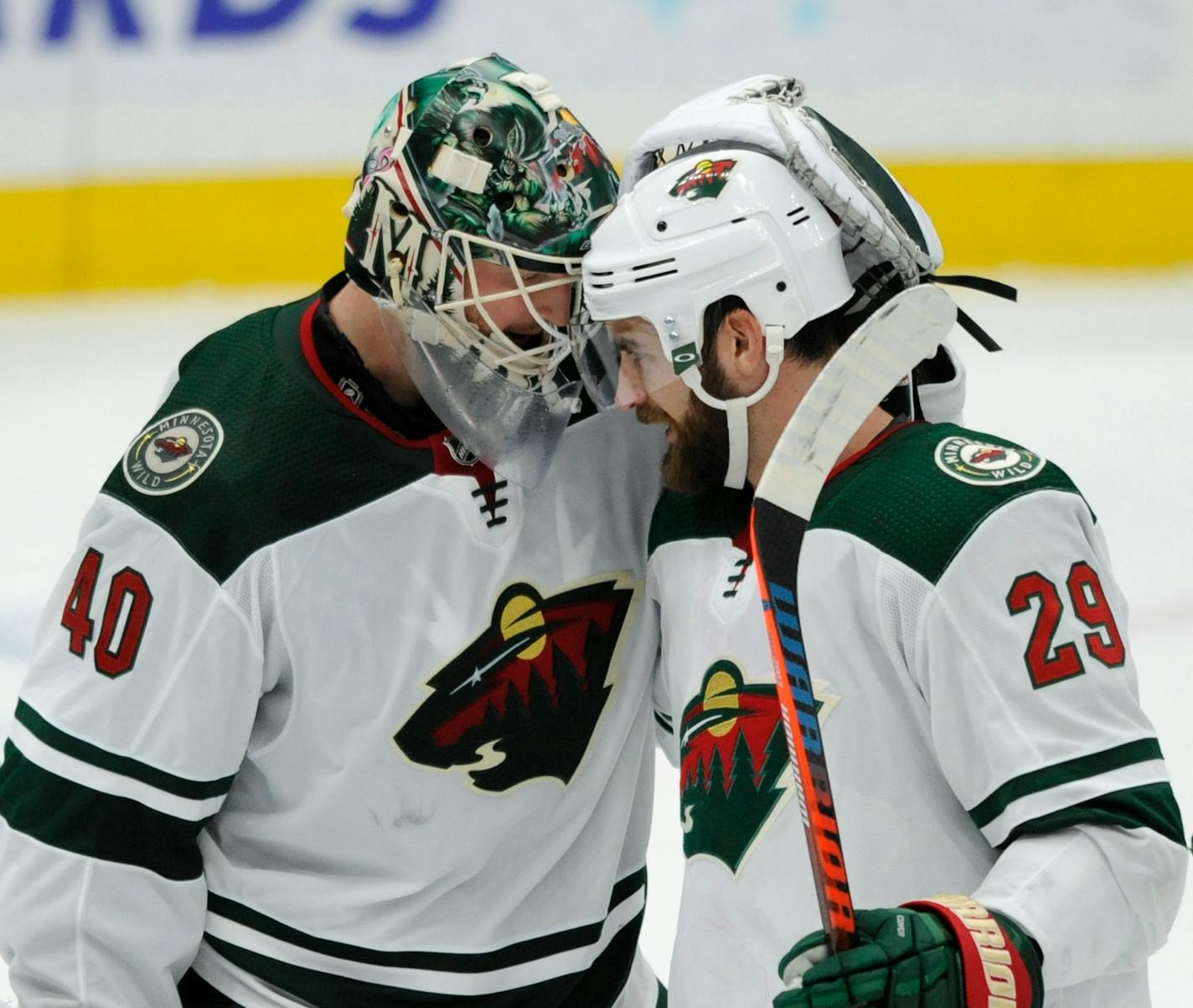 Wild goalie Devan Dubnyk celebrates with teammate Greg Pateryn after their victory over the St. Louis Blues