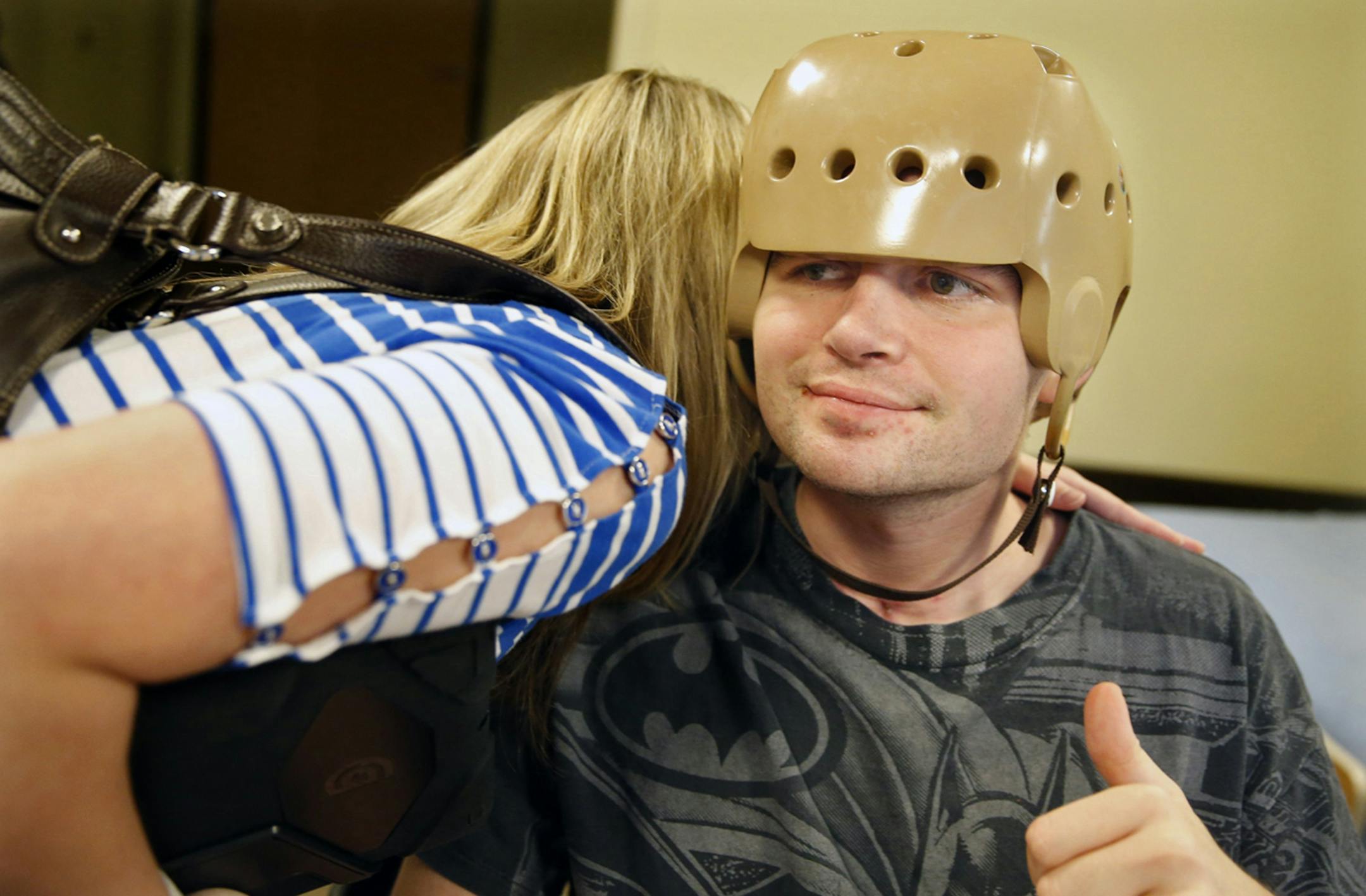 At the Courage Center in Golden Valley, Ray Widstrand, right, pictured October 8, 2013, is recovering from a near fatal attack in August, which landed him in intensive care. Part of his cranium was removed to alleviate pressure from swelling. His sister, Alice, visits him almost daily.