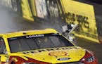 Joey Logano celebrates his victory in the NASCAR Sprint Cup series auto race Saturday night, Aug. 22, 2015, at Bristol Motor Speedway in Bristol, Tenn