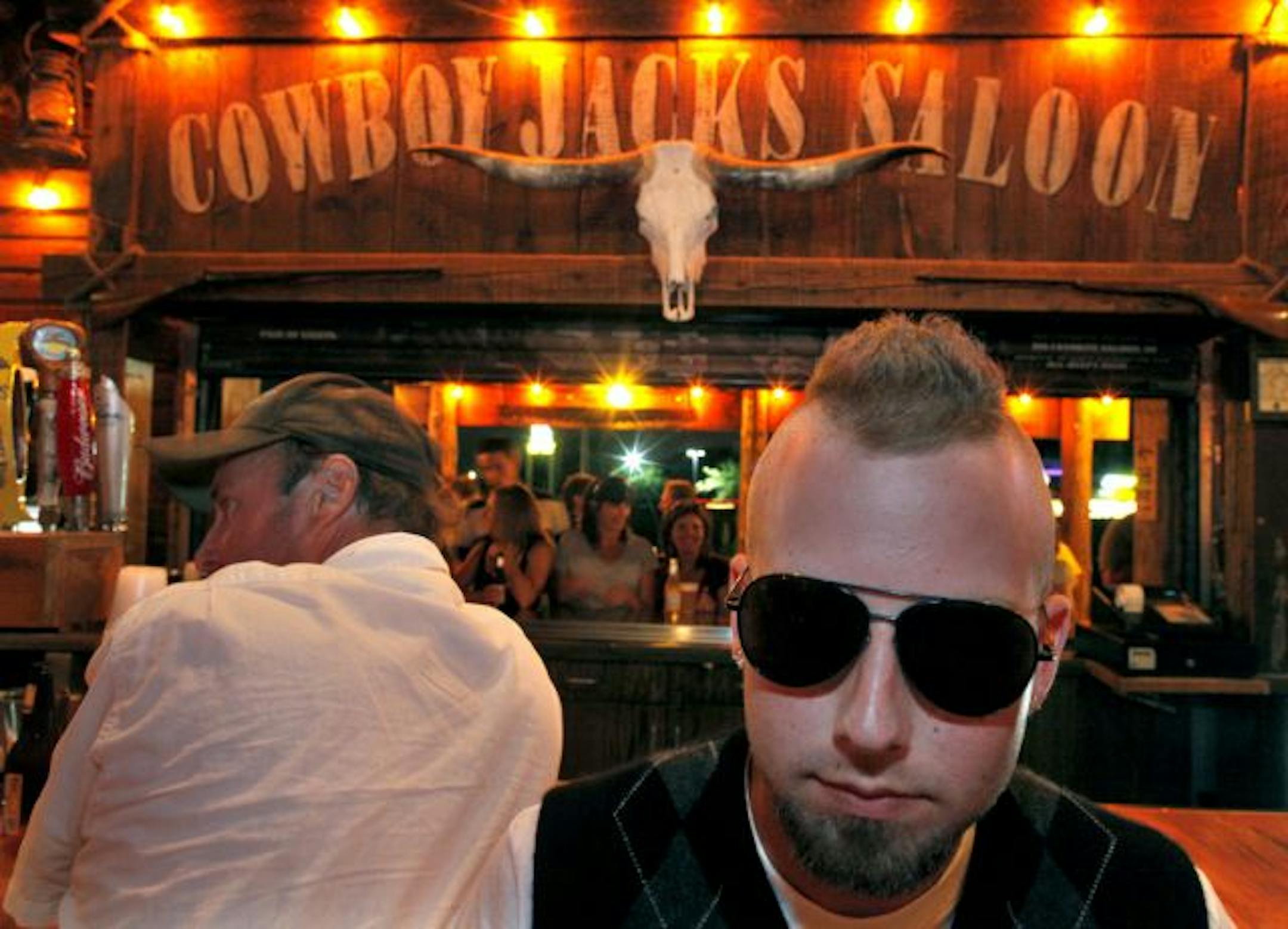 At Cowboy Jack's in Plymouth, there's nary a cowboy hat in sight. Riley Spear, of Chaska, prefers a mohawk.