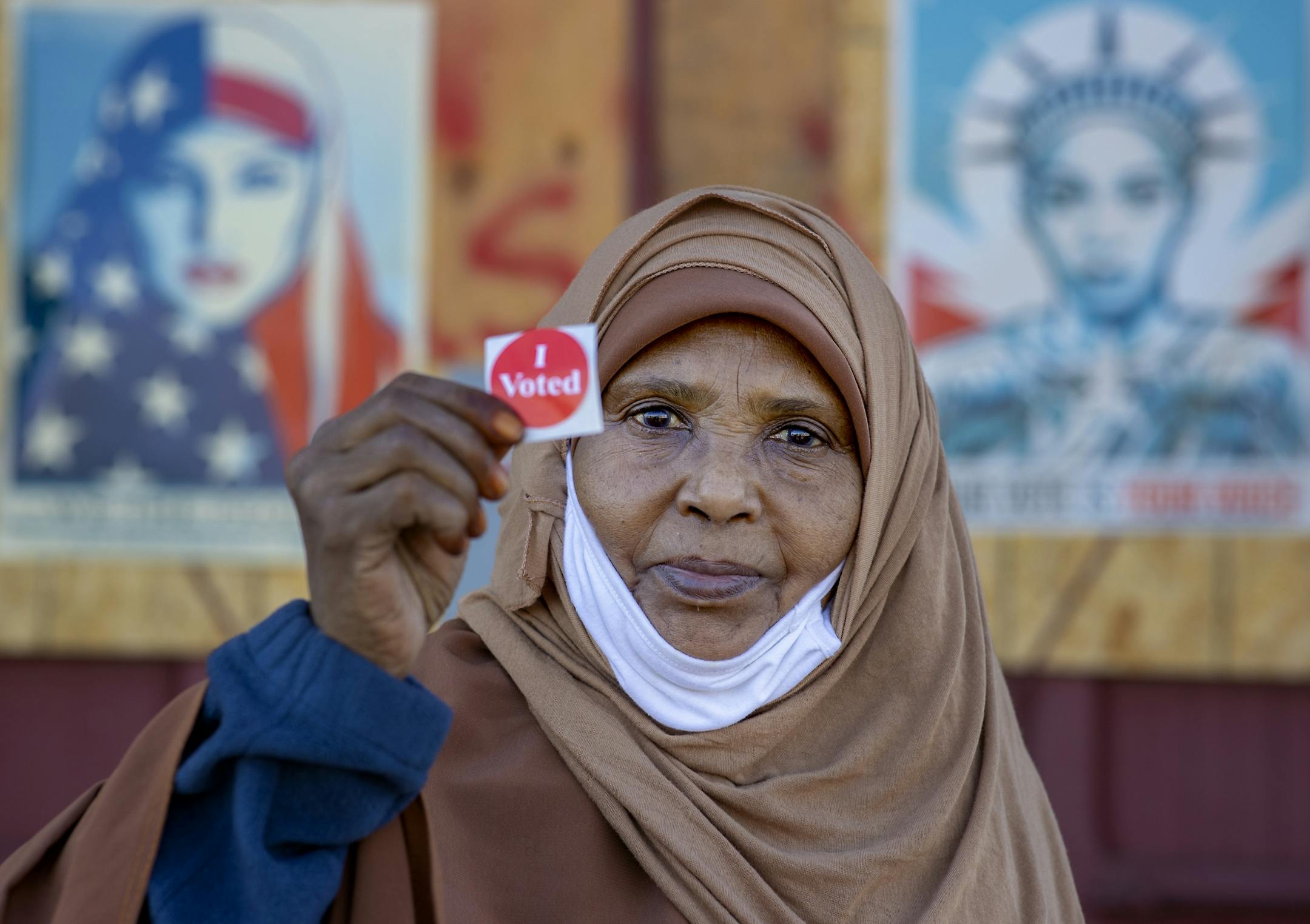 Fadima Hassan was more than happy to show off her "I Voted" sign after she voted at the Brian Coyle Center in Minneapolis on Tuesday.