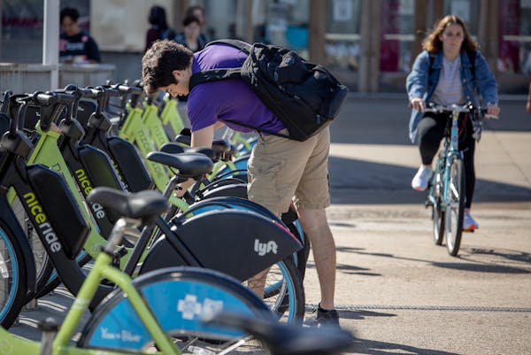 A student grabbed a Nice Ride bike to commute throughout campus Sept. 16, 2021, in Minneapolis.