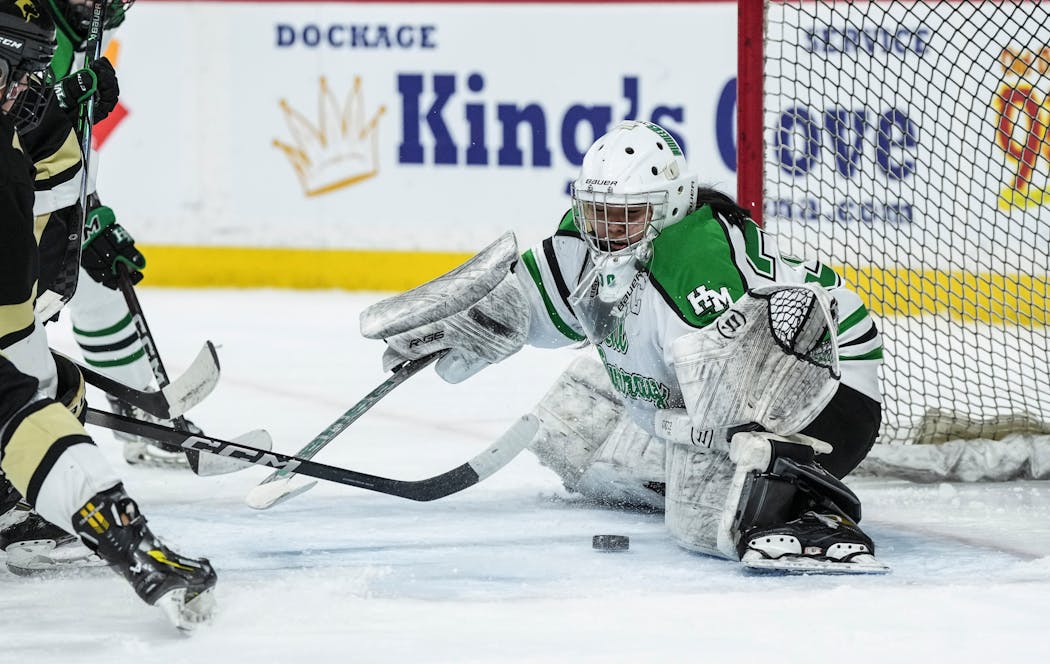 Hill-Murray goalie Grace Zhan reached to stop the puck in the second period. Zhan made 36 saves in her team's victory over Andover.