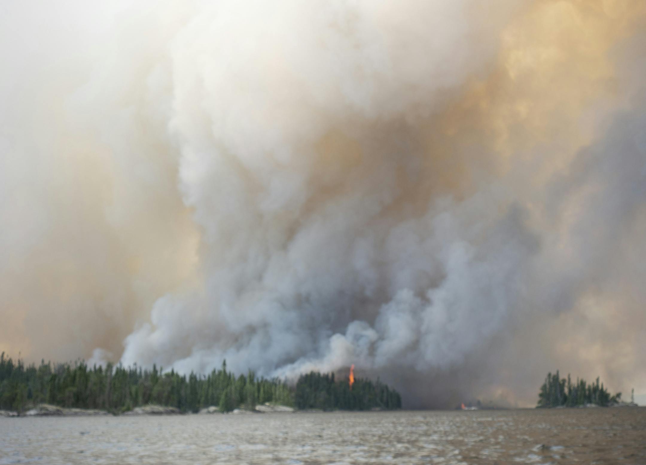 Peter Arnesen of the Twin Cities took this photo while alone, paddling a solo canoe away from a forest fire in Woodland Caribou Provincial Park, Ontario.
