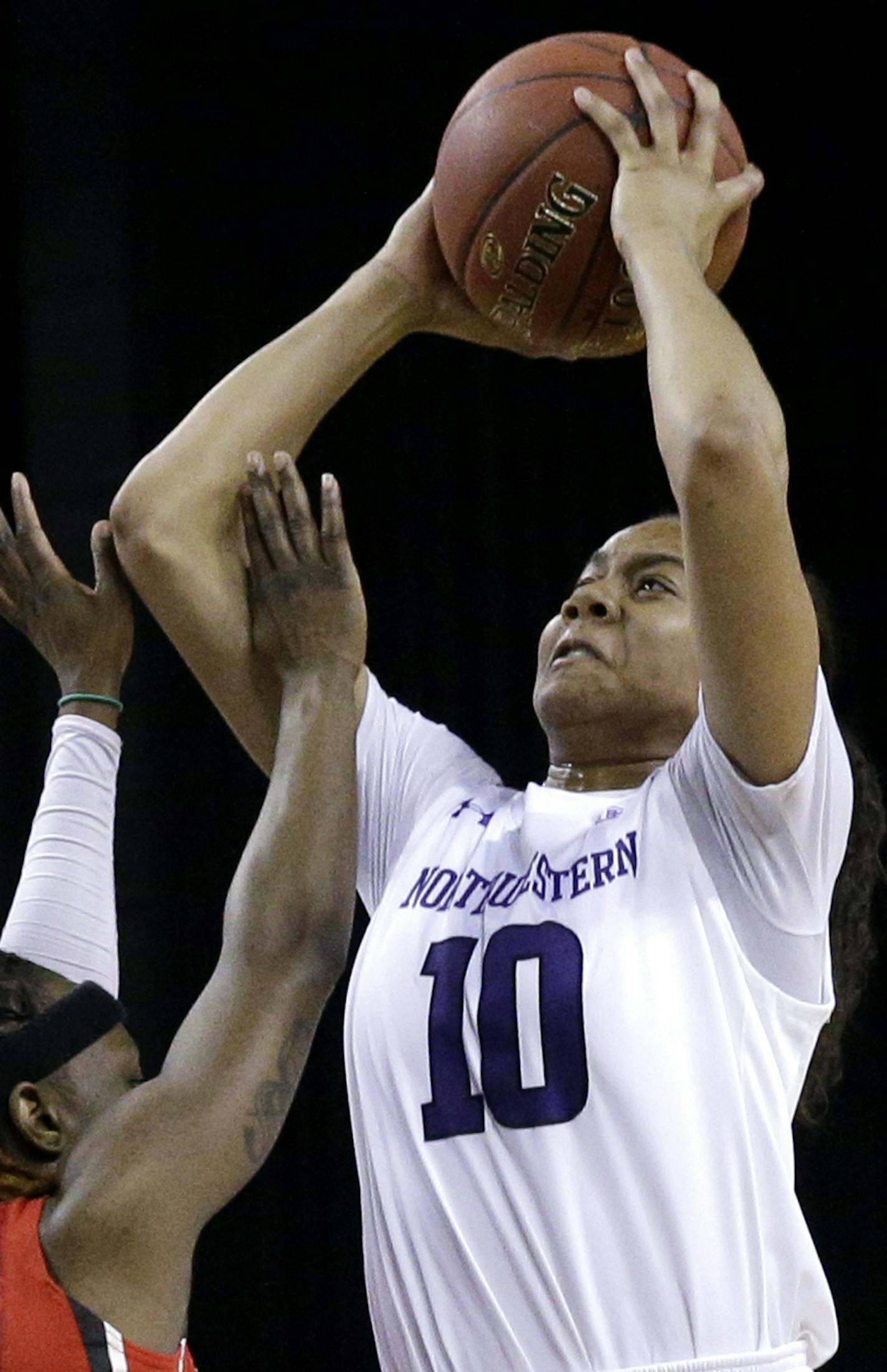 Northwestern forward Nia Coffey, right, goes up for a shot against Rutgers guard Syessence Davis during the second half of an NCAA college basketball game in the quarterfinals of the Big Ten Conference tournament in Hoffman Estates, Ill., on Friday, March 6, 2015. Northwestern won 62-57. (AP Photo/Nam Y. Huh) ORG XMIT: ILNH125