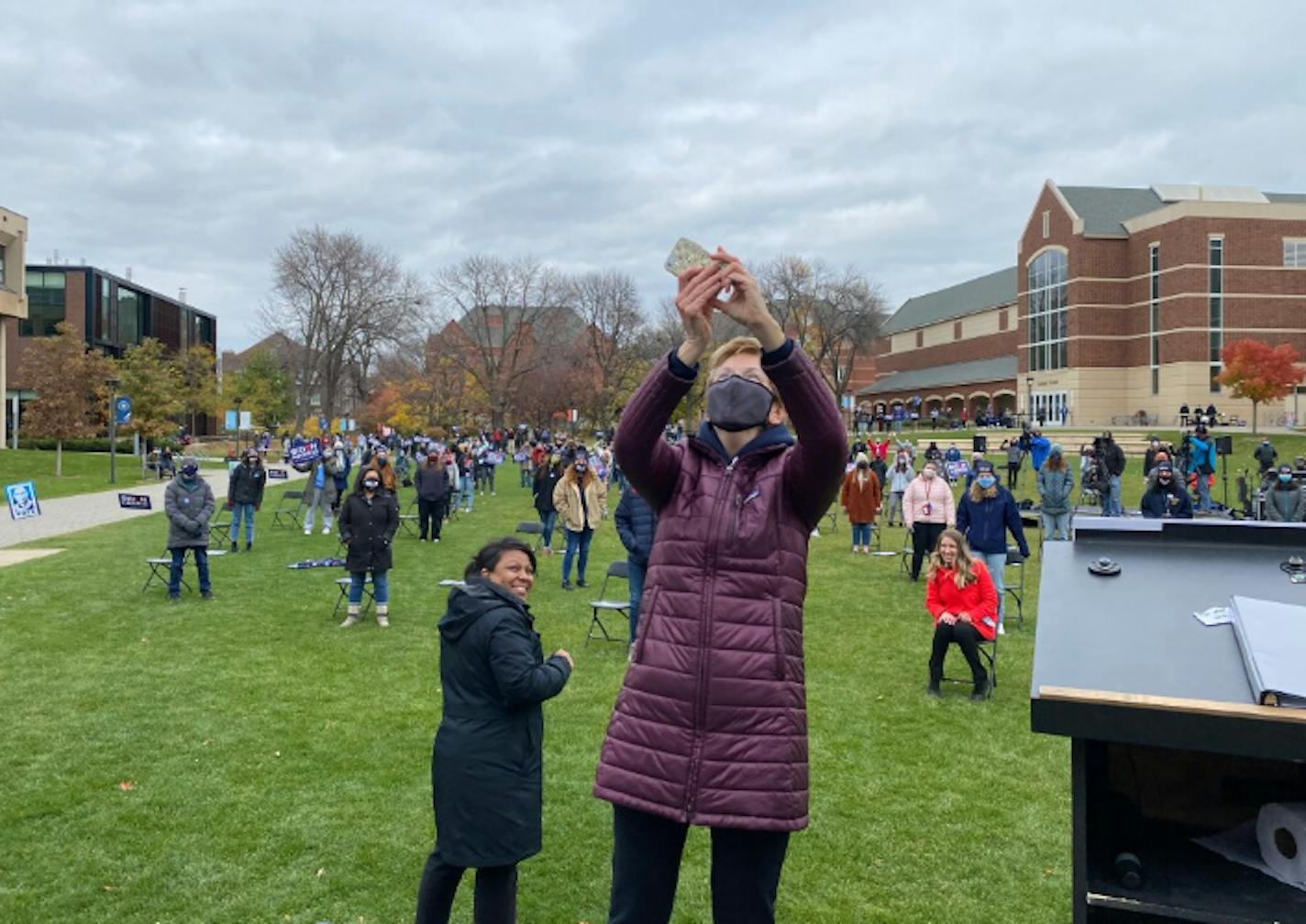 U.S. Sen. Elizabeth Warren, D-Mass., took crowd selfies during a campaign rally for Biden-Harris at the Macalester College campus on Sunday.