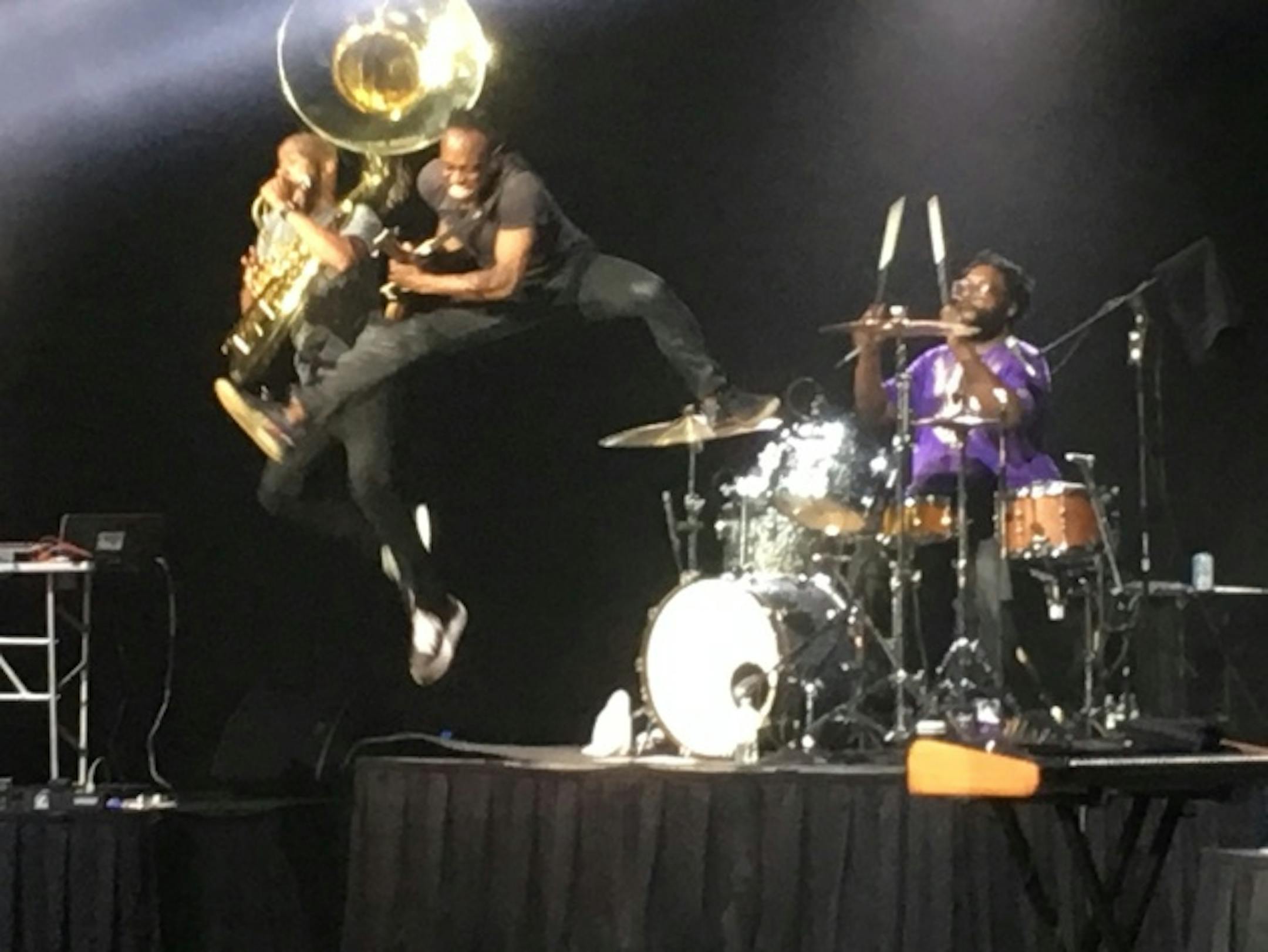 Damon Bryson and Cap'n Kirk Douglas leap off Questlove's drum kit to end the Roots' performance at Mystic Lake Casino Showroom