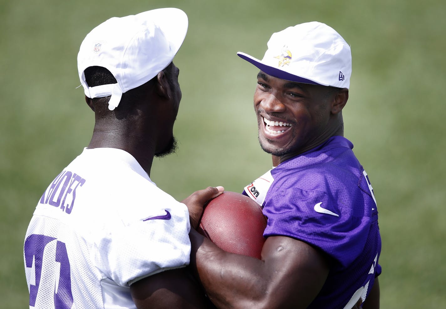 Minnesota Vikings Xavier Rhodes (29) defended Adrian Peterson (28) during the morning practice Tuesday.