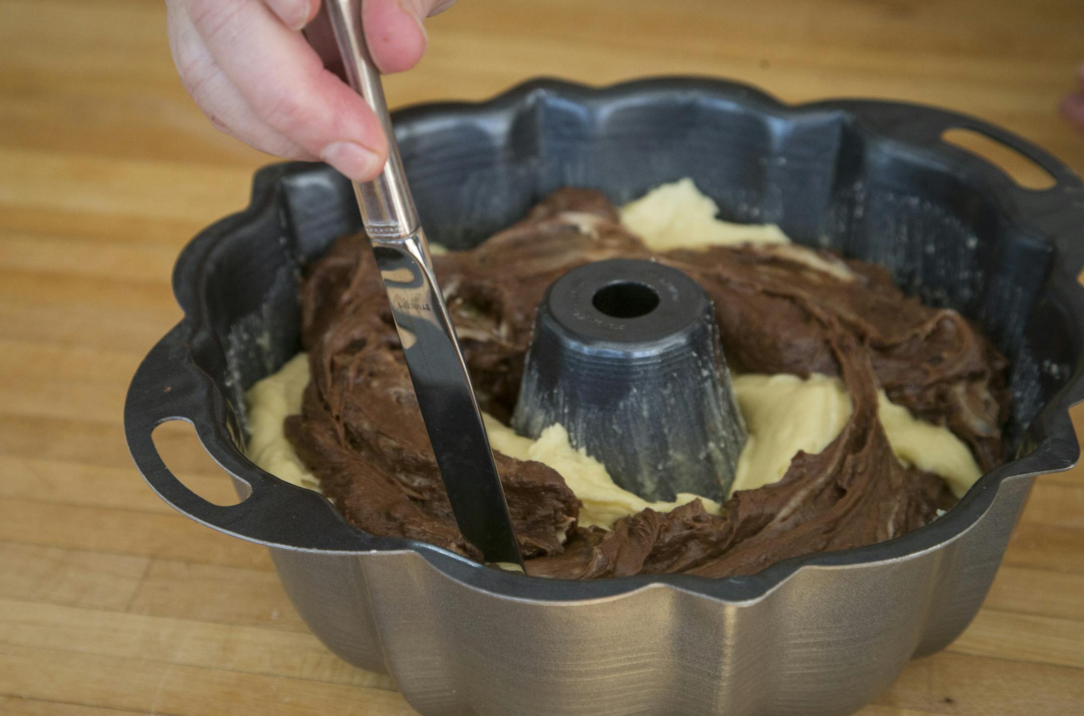 Pull a knife through the layered cake batter to marble.