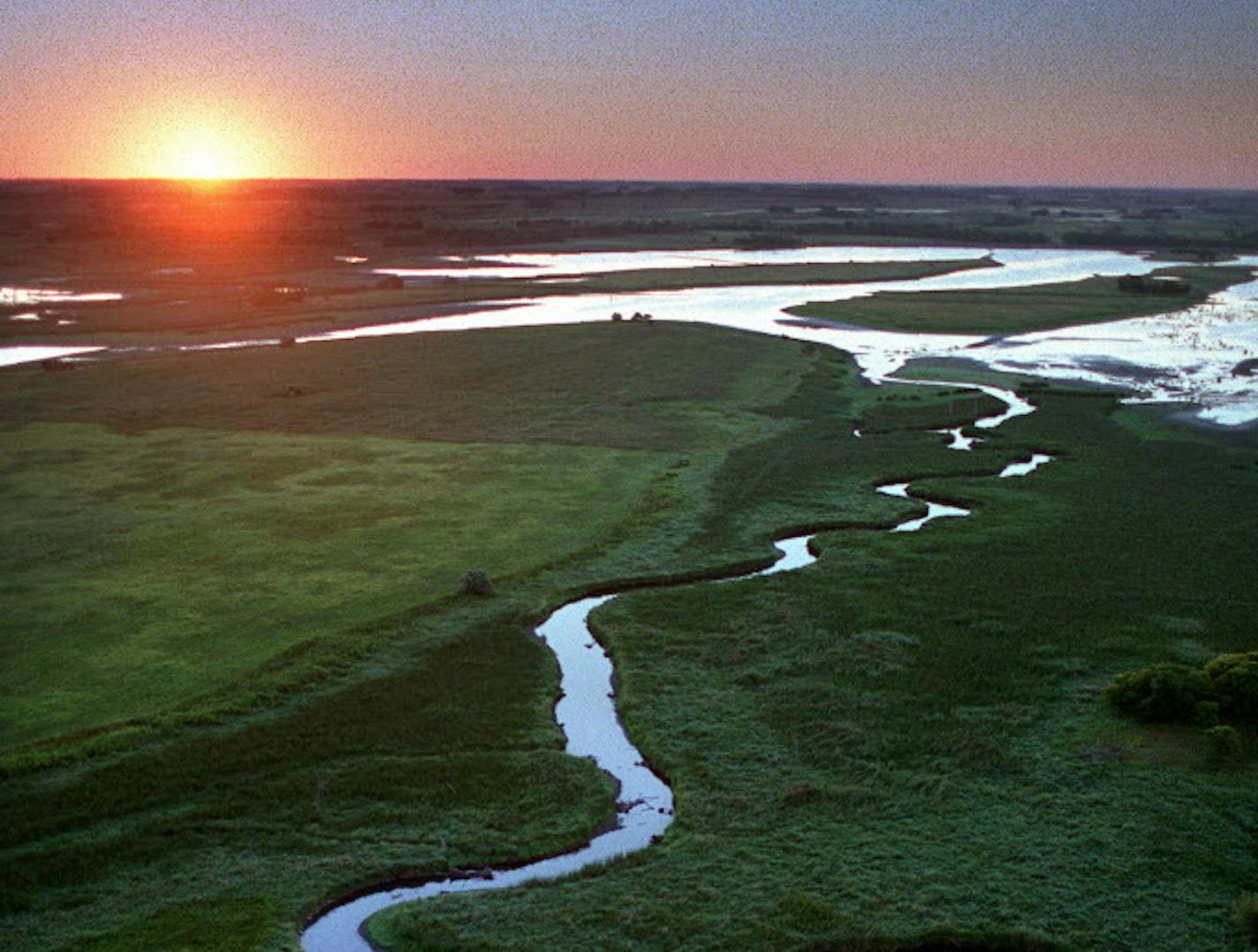 Near its beginning the Minnesota River is a beautiful place. Here, as it winds through Big Stone National Wildlife Refuge south east of Ortonville, the refuge serves as a major water fowl production and migration area and also contains more than 6,000 acres of grassland, including large tracts of native prairie. ORG XMIT: MIN2014091915422655 ORG XMIT: MIN1409191917113756