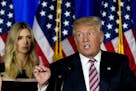 Republican presidential candidate Donald Trump is joined by his daughter Ivanka as he speaks during a news conference at the Trump National Golf Club 