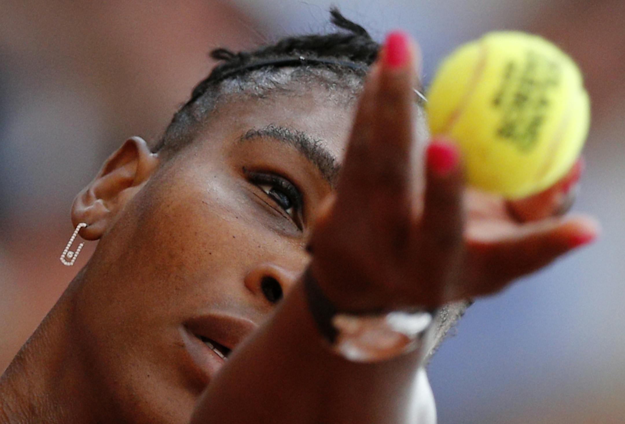 Serena Williams of the U.S. serves against Germany's Julia Georges during their third round match of the French Open tennis tournament at the Roland Garros stadium in Paris, France, Saturday, June 2, 2018. (AP Photo/Christophe Ena )