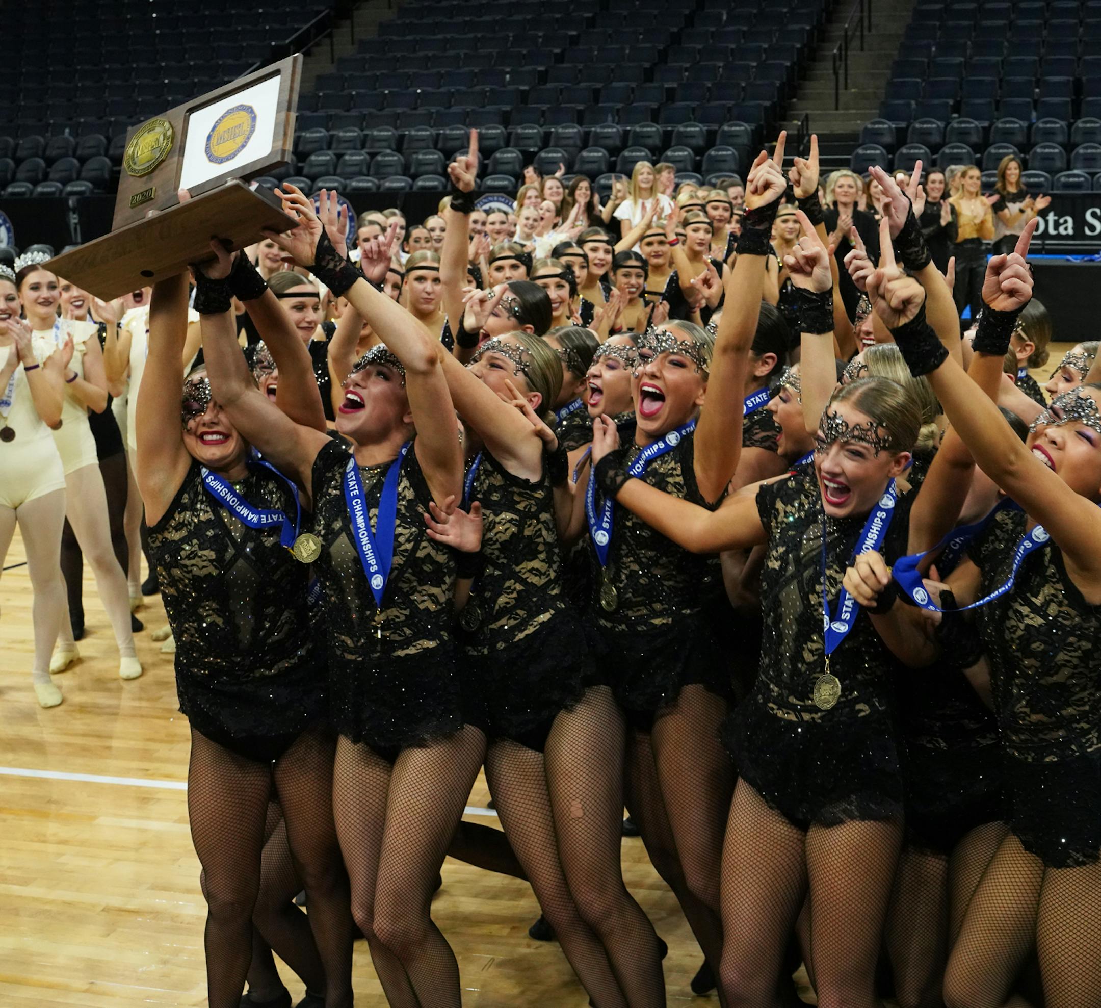 Eastview accepts the first place trophy at the class 3A MSHSL State High Kick Dance Tournament on Feb. 15, 2020 at the Target Center. [ Special to Star Tribune, photo by Matt Blewett, Matte B Photography, matt@mattebphoto.com, Feb. 15, 2020, MSHSL Dance Tournament, MSHSL dance, Target Center, Minnesota, SAXO 1010541031 PREP.dance