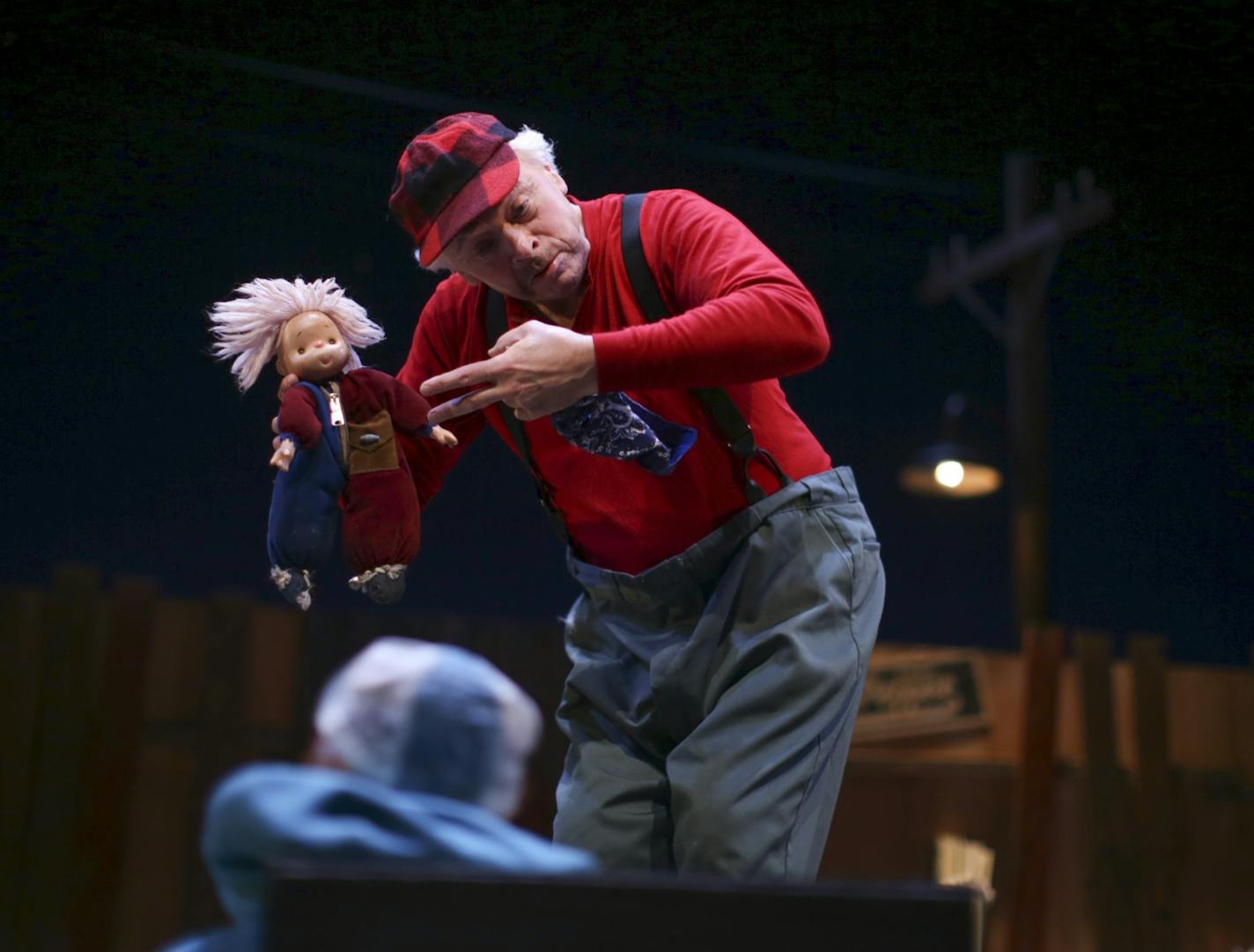 Gale LaJoye offered a doll to a small friend during scene from his solo show "Snowflake" at the Children's Theatre Company Sunday afternoon.