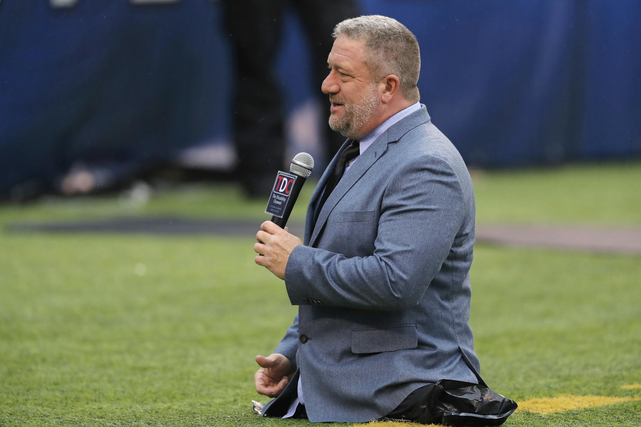 Dave Stevens, of the Disability Channel, reports on the field before a game between the New York Giants and the Philadelphia Eagles in December.