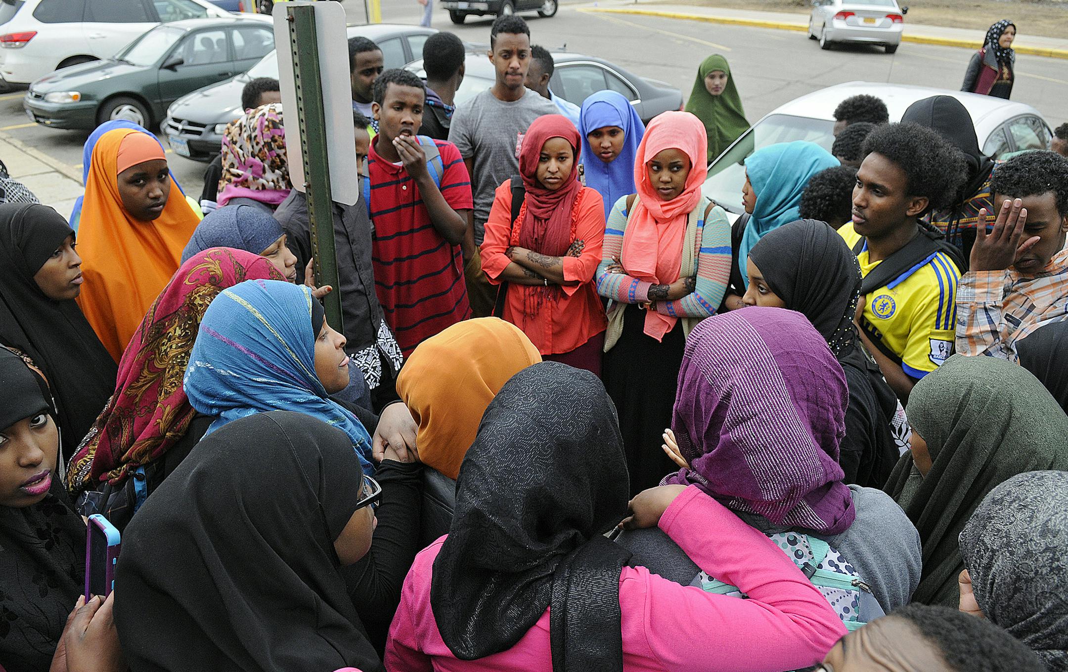 St. Cloud Technical High School students gather outside the school Wednesday, March 18, 2015. More than 100 students and a few parents protested racial social media posts and other incidents. (AP Photo/The St. Cloud Times, Dave Schwarz)