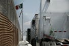 Trucks line up at the Corboba - LasAmericas international bridge to cross with their cargo from Mexico into the United States, in Ciudad Juarez, Mexic