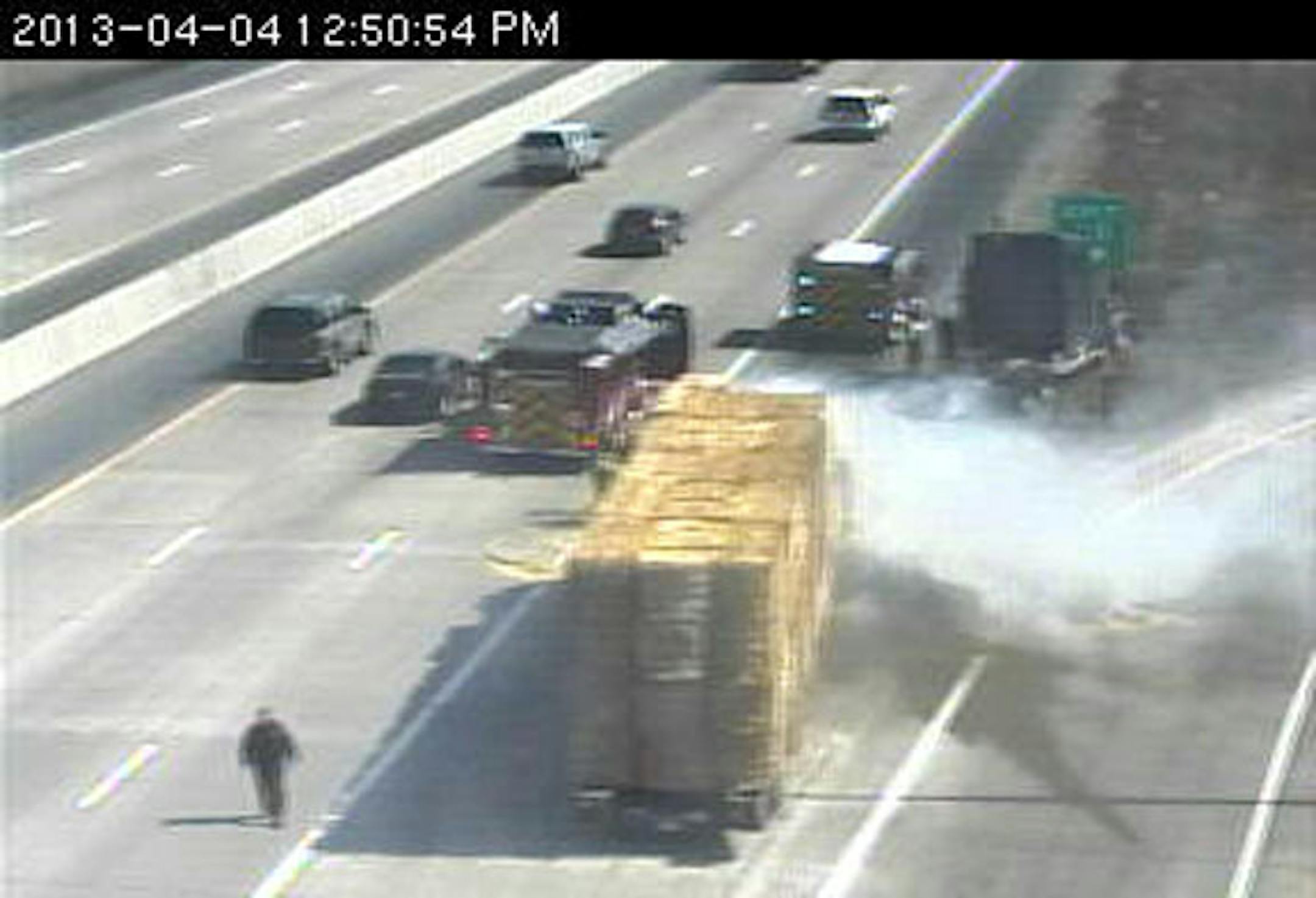 Hay on fire along highway in Brooklyn Park.