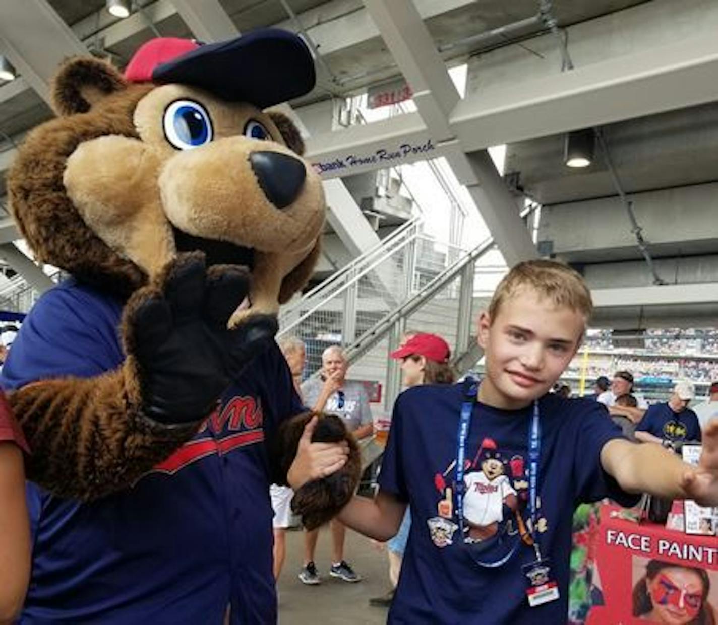 Chris Okey, of Richfield, said his 15-year-old special needs son, Isaac, &#x201c;is a huge fan&#x201d; of Wilfahrt as T.C. Bear and got to know his favorite mascot during visits to Target Field and the State Fair. Credit: Provided by Chris Okey