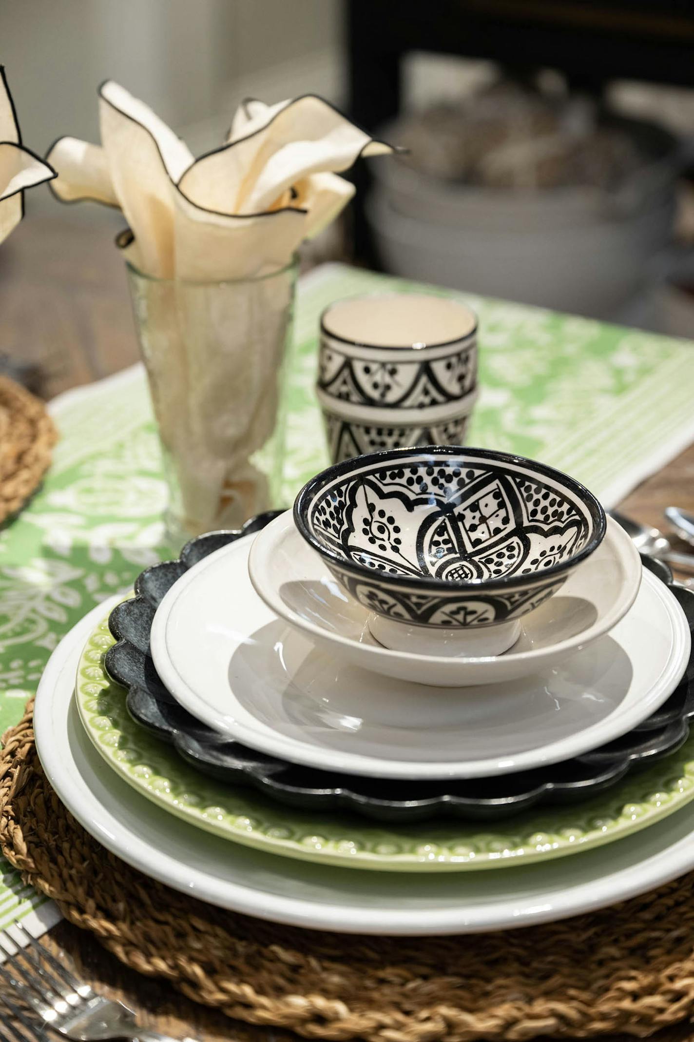 A pop of green in the dishes adds continuity to the design while white and black painted dishes add interest and texture.(Handout/TNS)