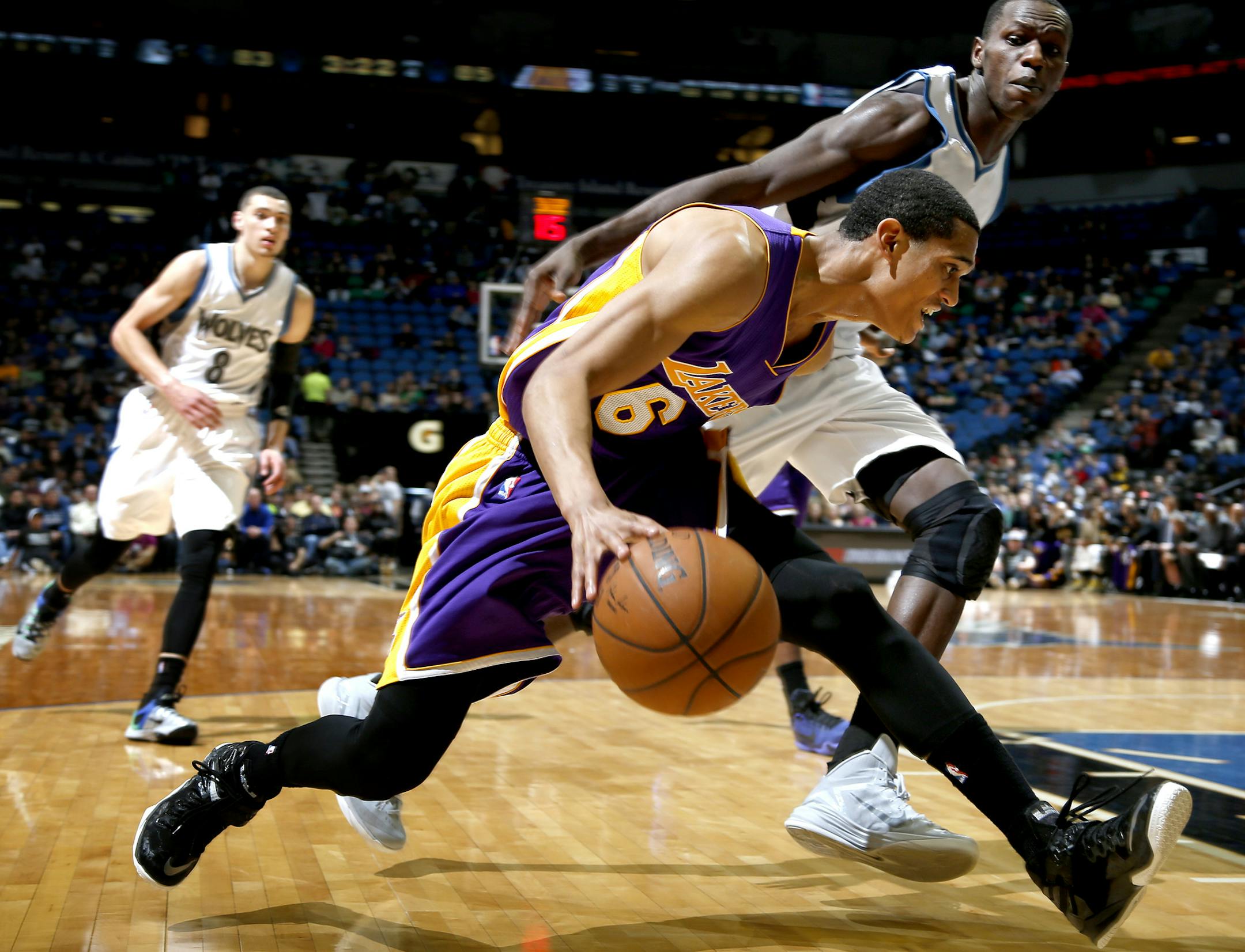 Jordan Clarkson (6) was defended by Gorgui Dieng (5) in the fourth quarter. LA beat Minnesota by a final a score of 101-99 ] CARLOS GONZALEZ cgonzalez@startribune.com, March 25, 2015, Minneapolis, Minn., Target Center, NBA, Minnesota Timberwolves vs. Los Angeles Lakers