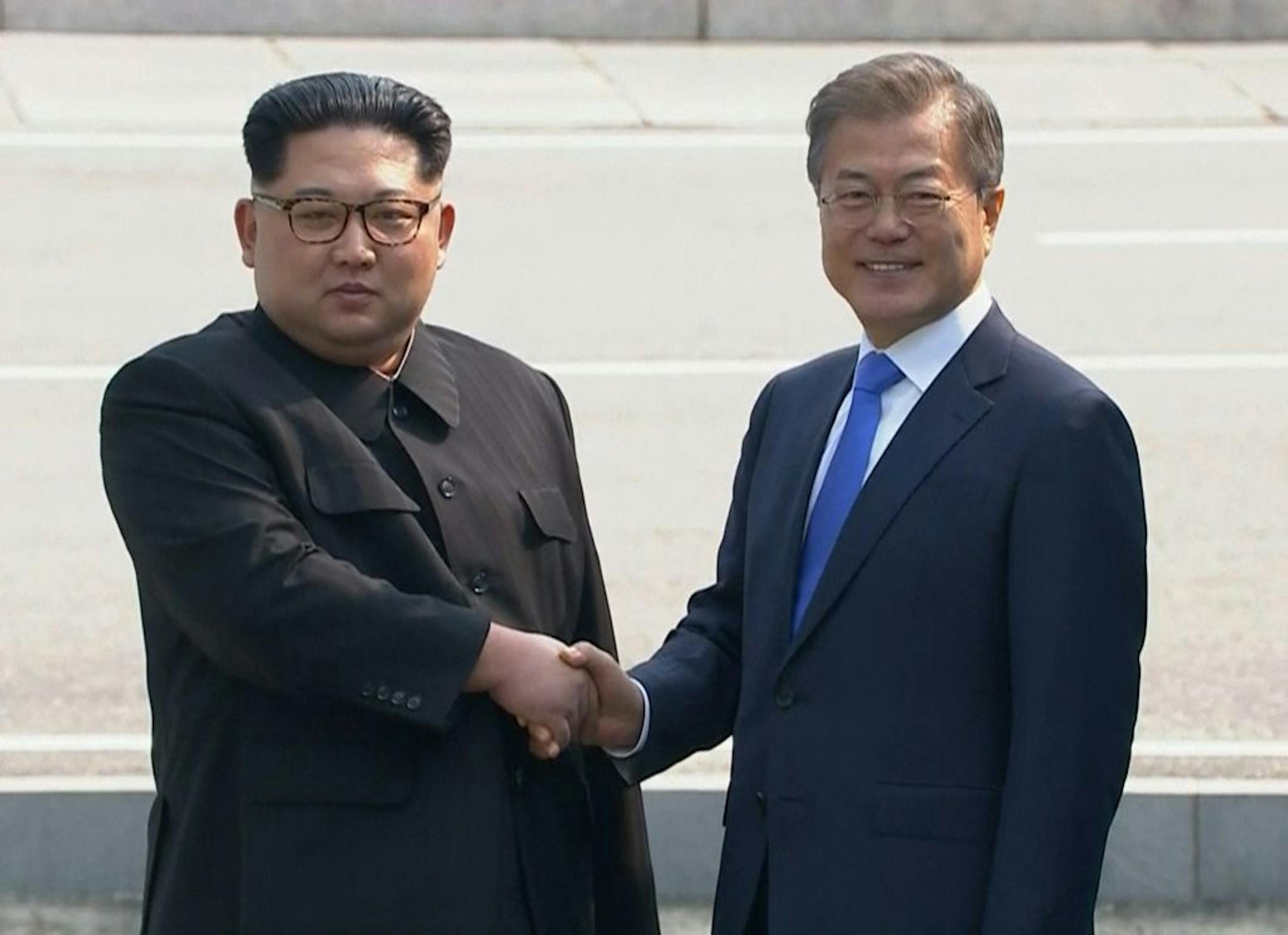 In this image taken from video provided by Korea Broadcasting System (KBS) Friday, April 27, 2018, North Korean leader Kim Jong Un, left, shakes hands with South Korean President Moon Jae-in as Kim crossed the border into South Korea for their historic face-to-face talks, in Panmunjom. Their discussions will be expected to focus on whether the North can be persuaded to give up its nuclear bombs.
