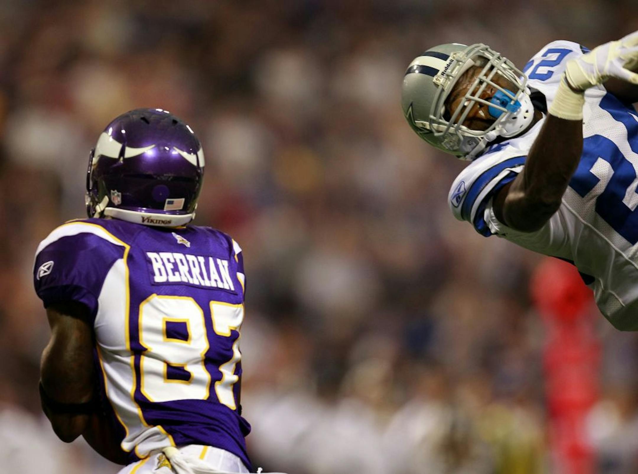Vikings receiver Bernard Berrian caught a pass for touchdown while being defended by Abram Elam (24) in the first quarter.