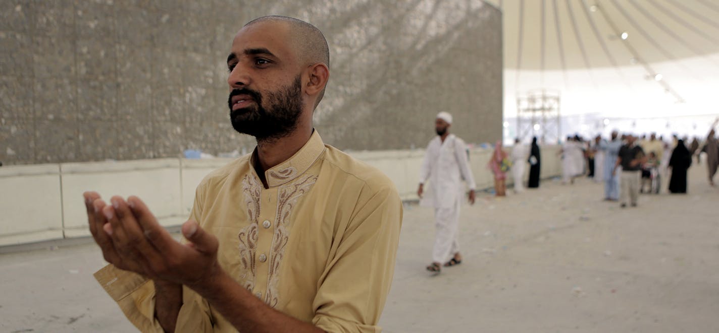 A Muslim pilgrim prays after casting pebbles in a symbolic stoning of the devil, during the annual pilgrimage, known as the hajj, in Mina, a desert tent city just outside the holy city of Mecca Saudi Arabia, Monday, Oct. 6, 2014. Male pilgrims shaved their heads as a sign of renewal. More than 2 million pilgrims took part this year. (AP Photo/Khalid Mohammed) ORG XMIT: MIN2014100714181248