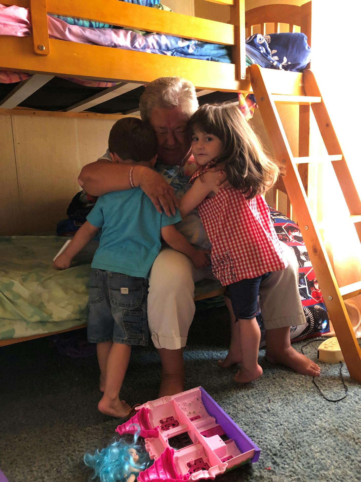 Zoey Hall, right, and her brother Spencer comforting their grandmother, Sandra McAdams. MUST CREDIT: Washington Post photo by John Woodrow Cox.