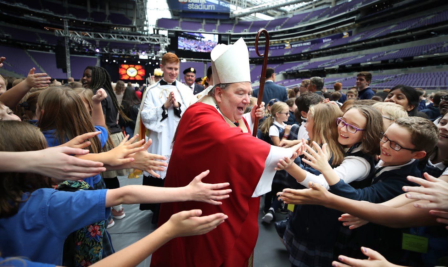 Bishop Bernard Hebda of the Archdiocese of Saint Paul and Minneapolis high fived students after services for 12,000 Catholic school children that gathered for Mass of the Holy Spirit at U.S. Bank Stadium Wednesday October 10, 2018 in Minneapolis, MN.