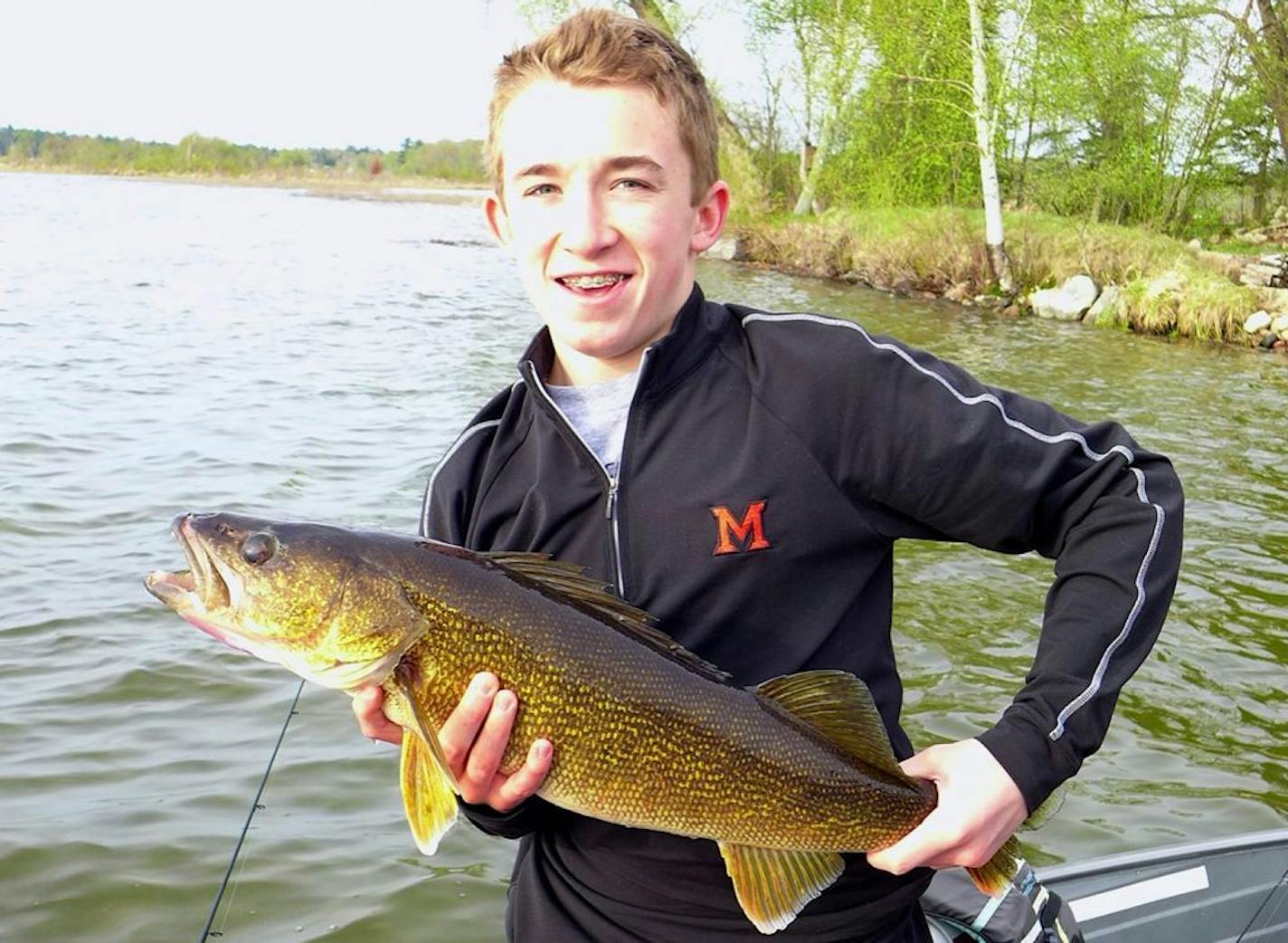 Casey Dornbach, Edina, with a 29-inch walleye he caught and released on Roosevelt Lake.