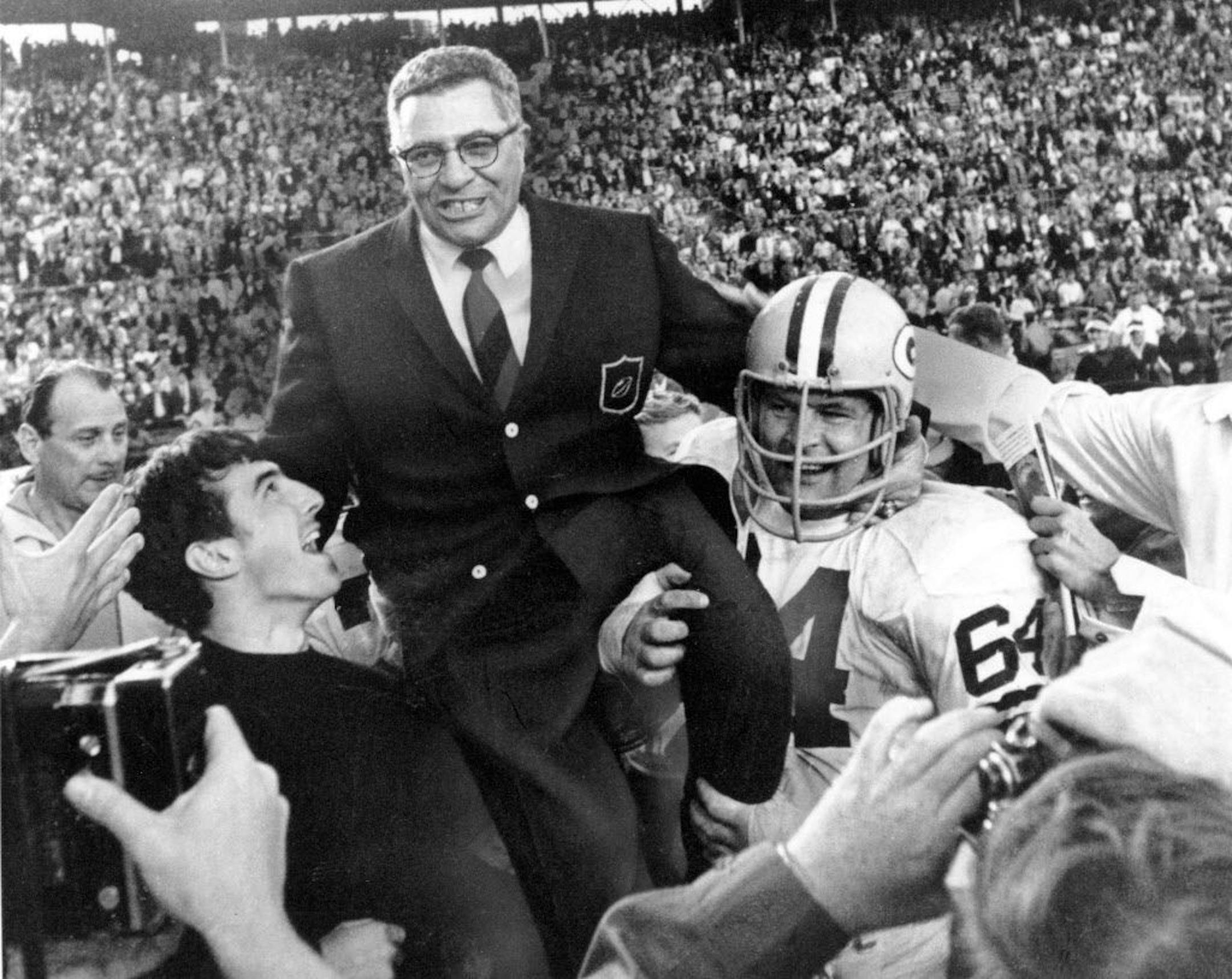 FILE-This Jan. 14, 1968 file photo shows Green Bay Packers coach Vince Lombardi being carried off the field after his team defeated the Oakland Raiders 33-14 in Super Bowl II in Miami, Fla. Packers guard Jerry Kramer (64) is at right. OK, Cheeseheads. Get ready to visit Broadway. "Vince," a play about the legendary Green Bay Packers coach Vince Lombardi, is planned for New York next season. Producers Tony Ponturo and Fran Krimser say the play by Eric Simonson will open during the fall of 2010. T