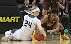 Eugene,OR - March 16, 2018 The Minnesota Gophers' kenisha Bell ties up Green Bay's Allie LeClaire for a held ball during the Gophers' 89-77 win over t